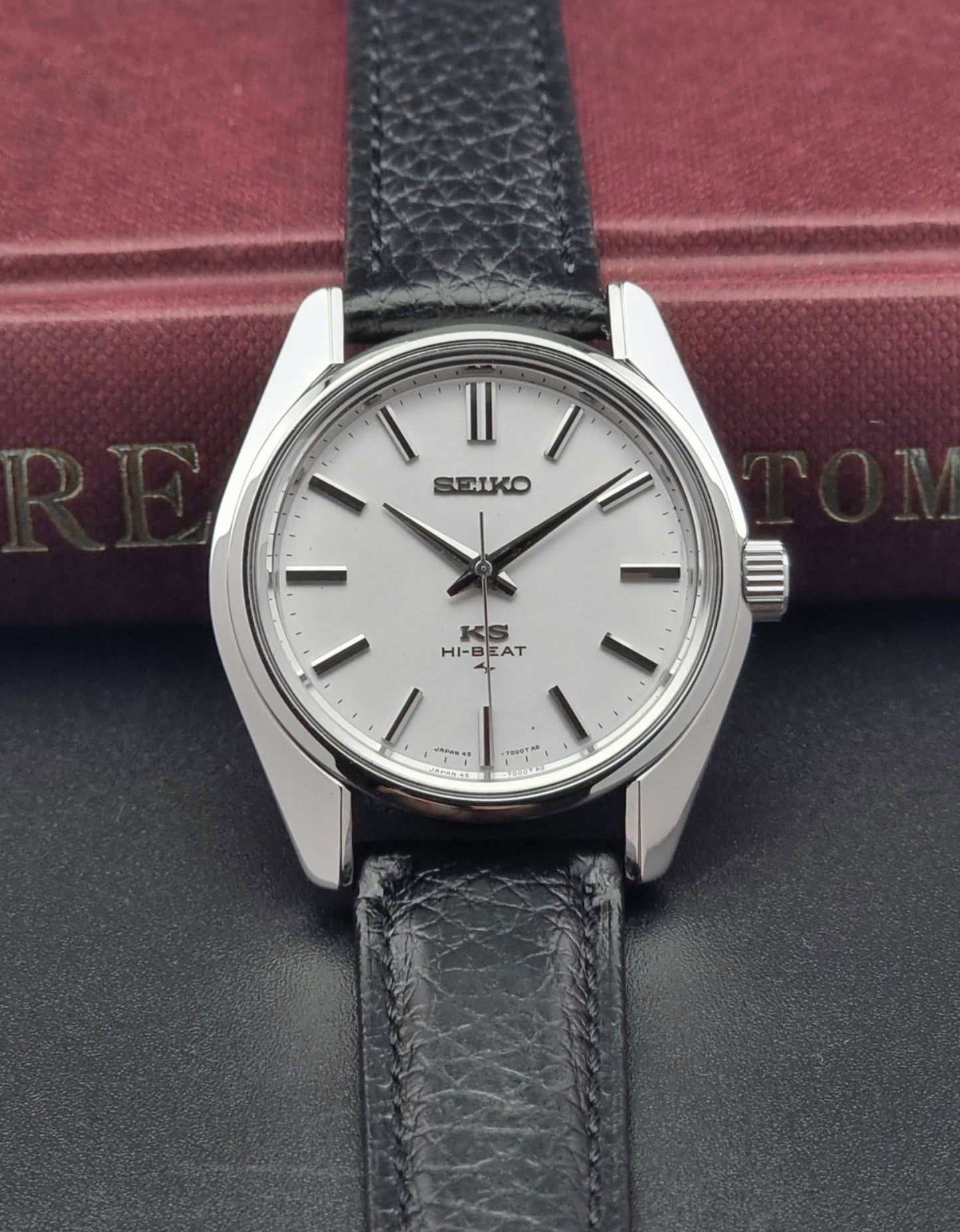 King Seiko 45-7001 watch with black leather strap on a dark surface
