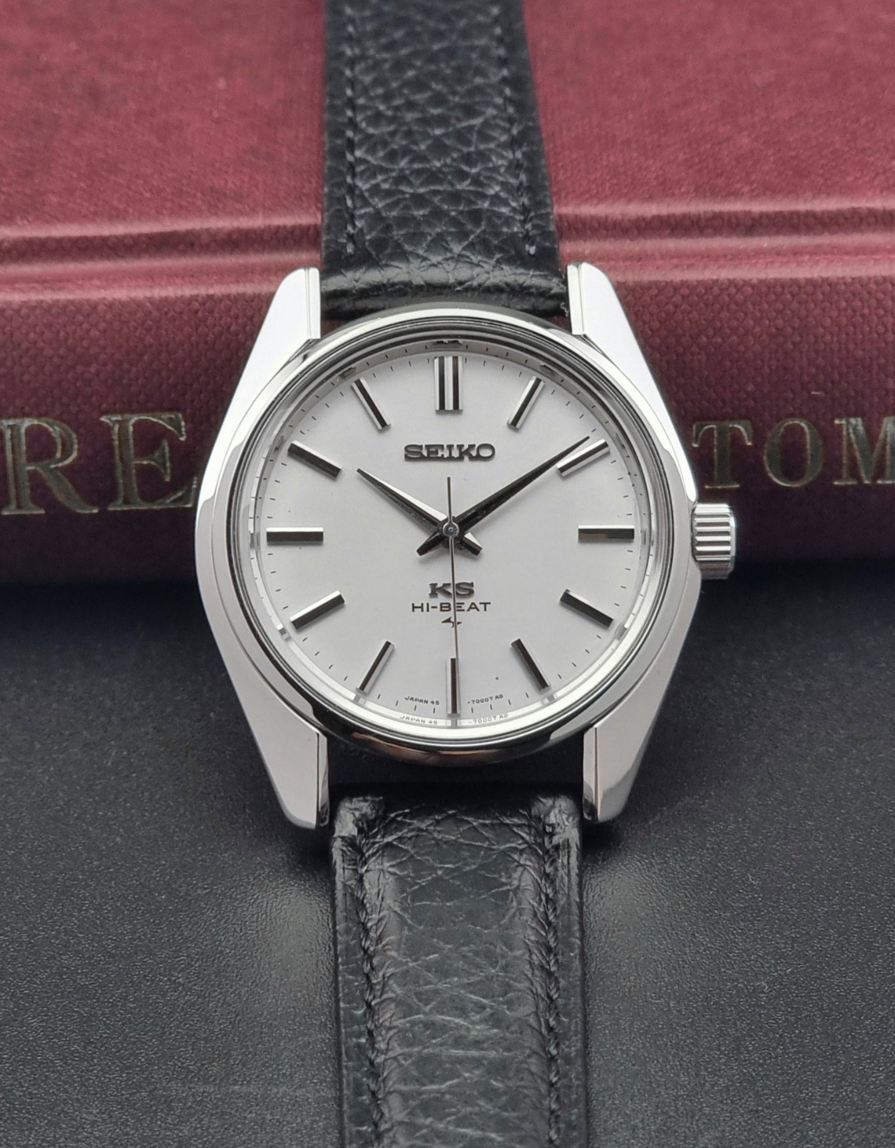 King Seiko 45-7001 watch with black leather strap on a dark surface