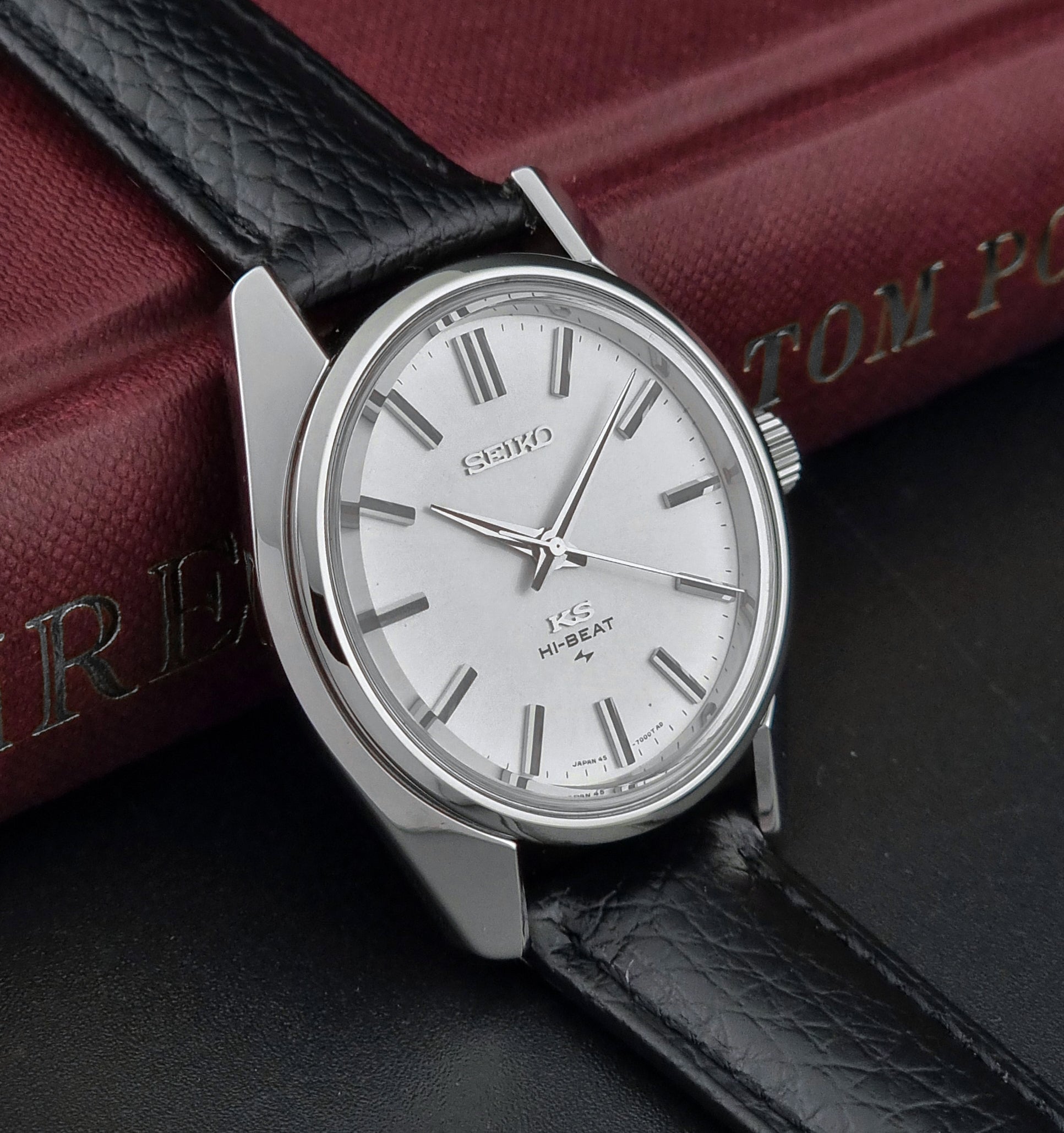 King Seiko 45-7001 watch with black leather strap on a dark surface