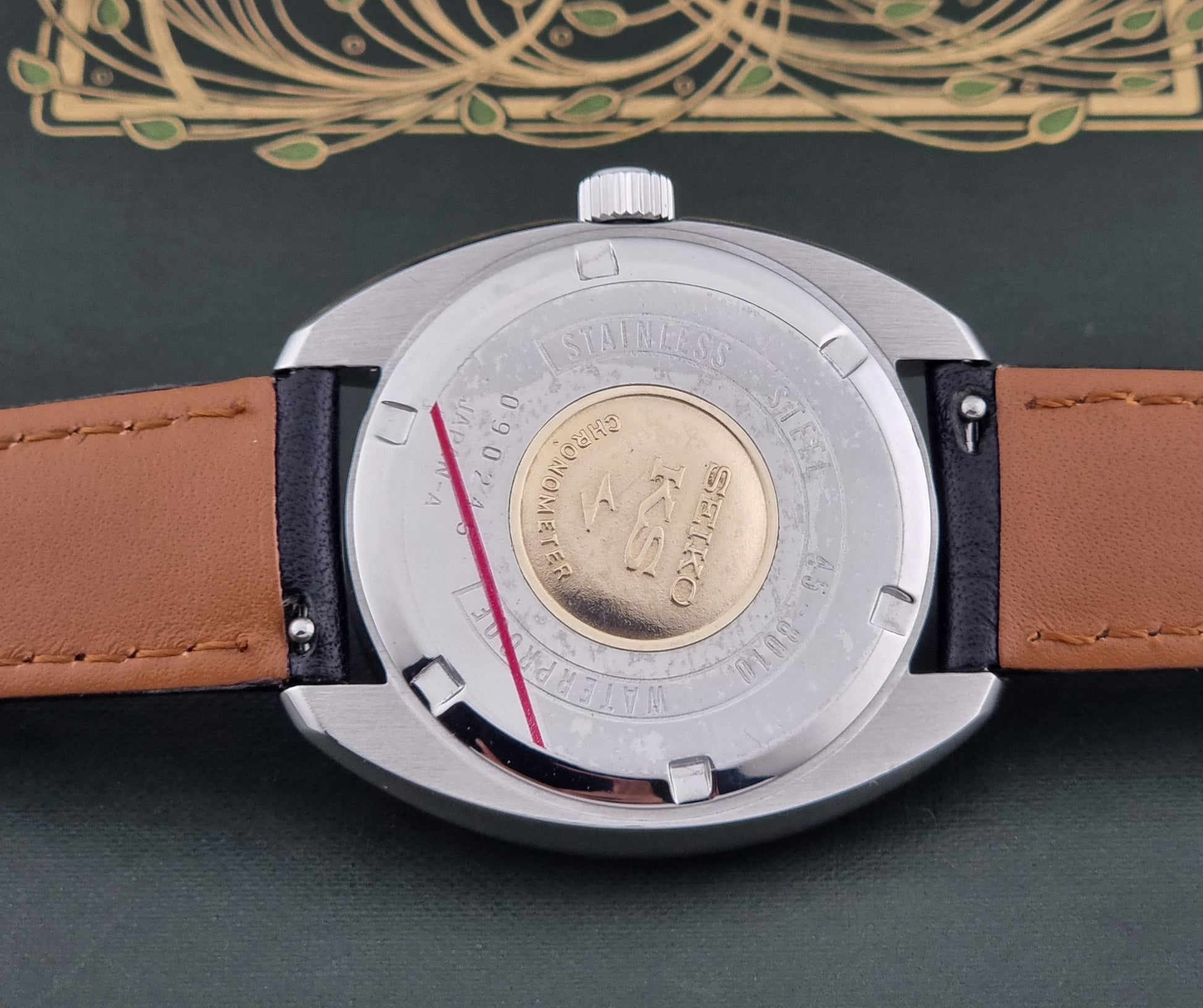 Vintage King Seiko Wristwatch 45-8010 close up of the case back with  gold medallion and KS logo