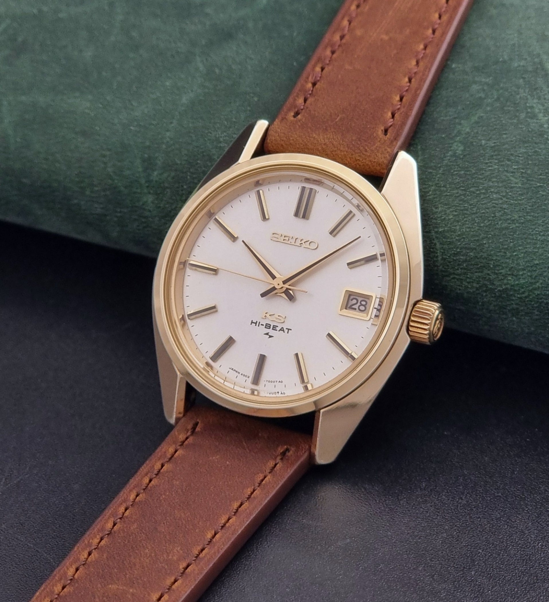 Vintage King Seiko 4502-7001 Wristwatch with brown leather strap on a dark surface crown view