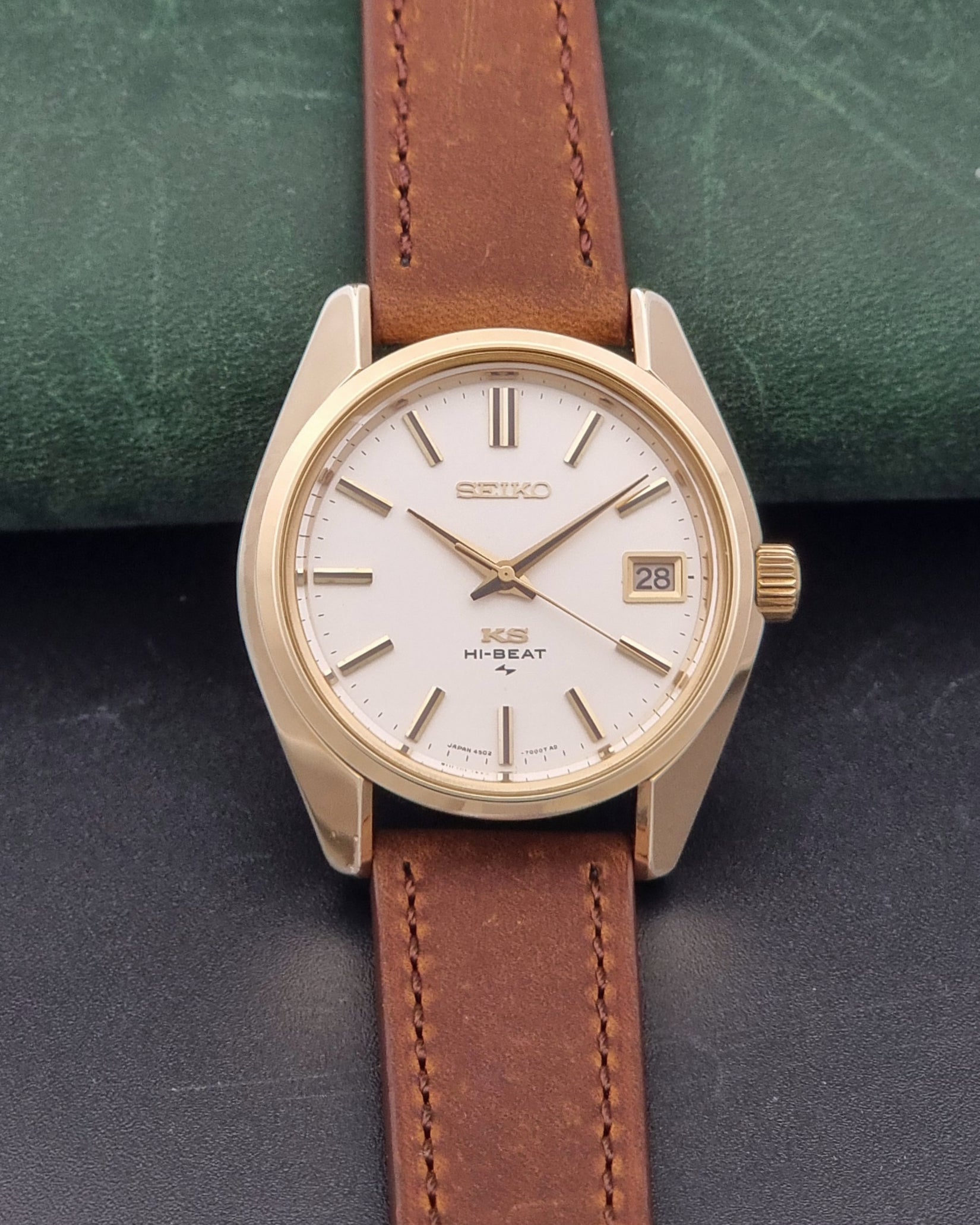 Vintage King Seiko 4502-7001 Wristwatch with brown leather strap on a dark surface dial view