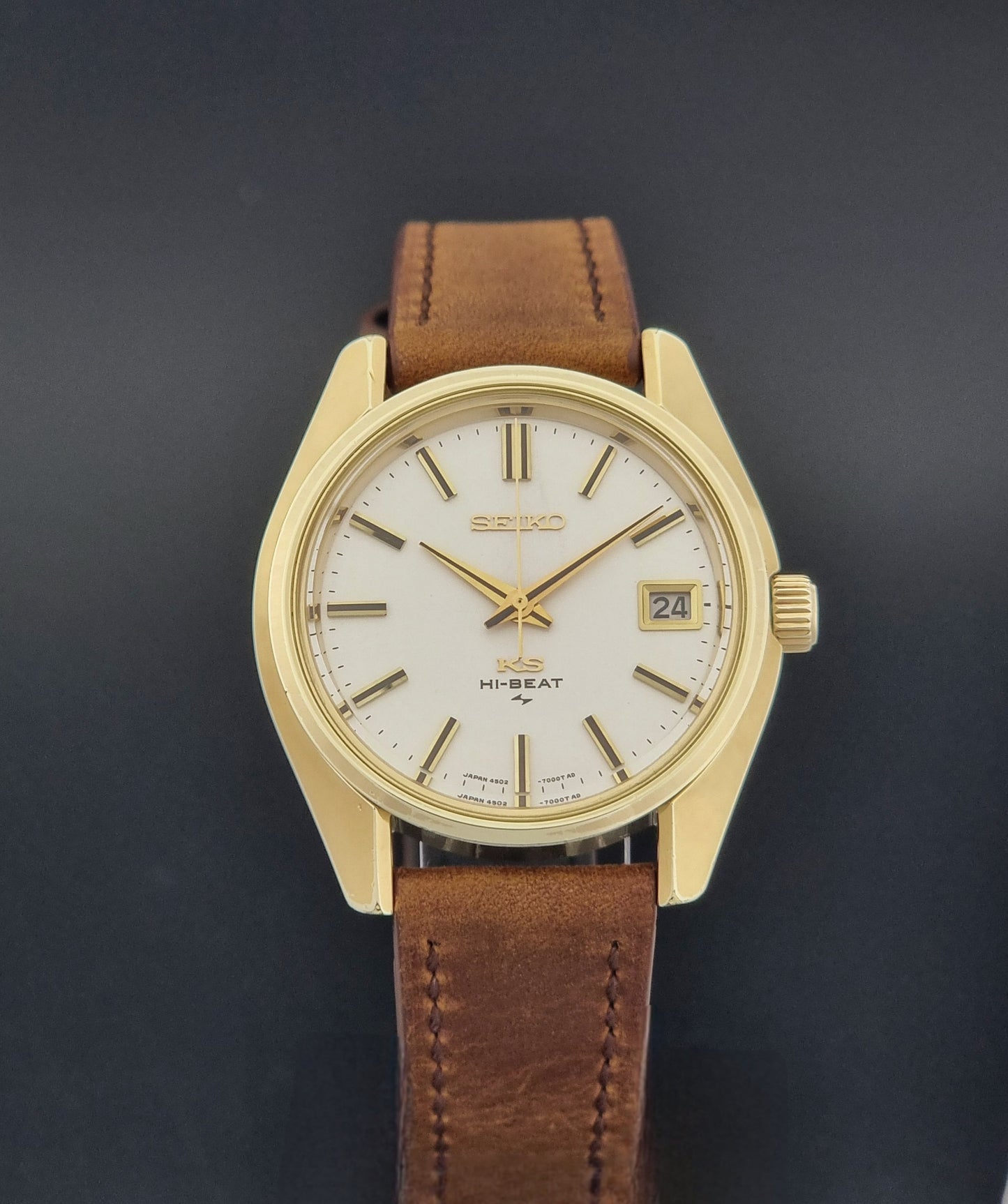 Vintage King Seiko Wristwatch 4502-7001 brown leather strap on a dark gray background close dial view