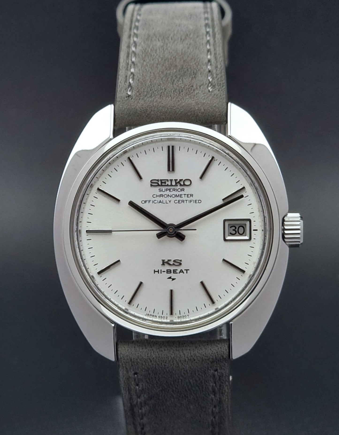 King Seiko Watch Hi-Beat 4502-8010 with gray strap and silver dial on a dark background front