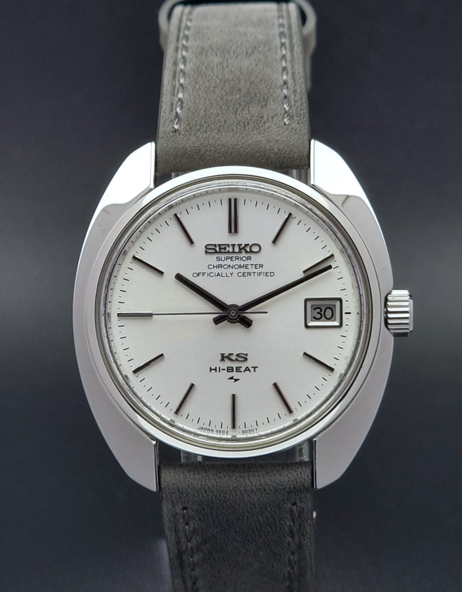 King Seiko Watch Hi-Beat 4502-8010 with gray strap and silver dial on a dark background front