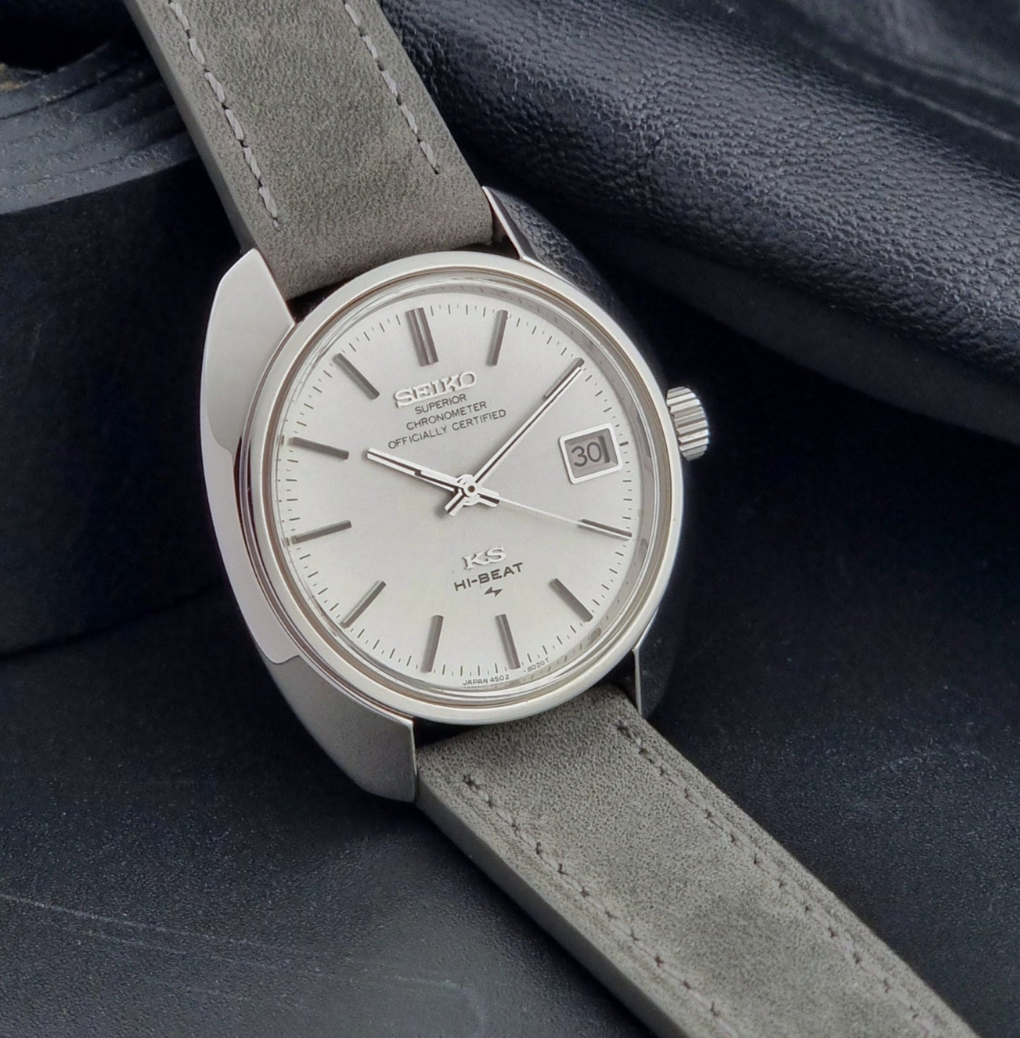 King Seiko Watch Hi-Beat 4502-8010 with gray strap on a dark background side view