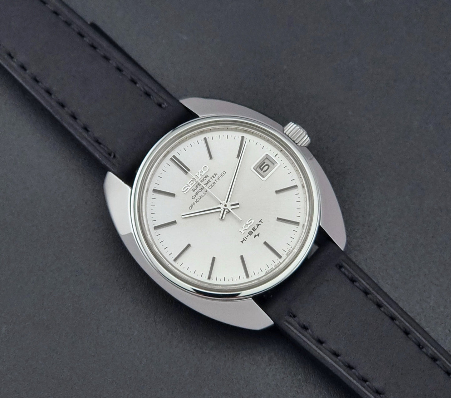 Vintage King Seiko Watch 4502-8010 with a black leather strap on a dark background close up dial view