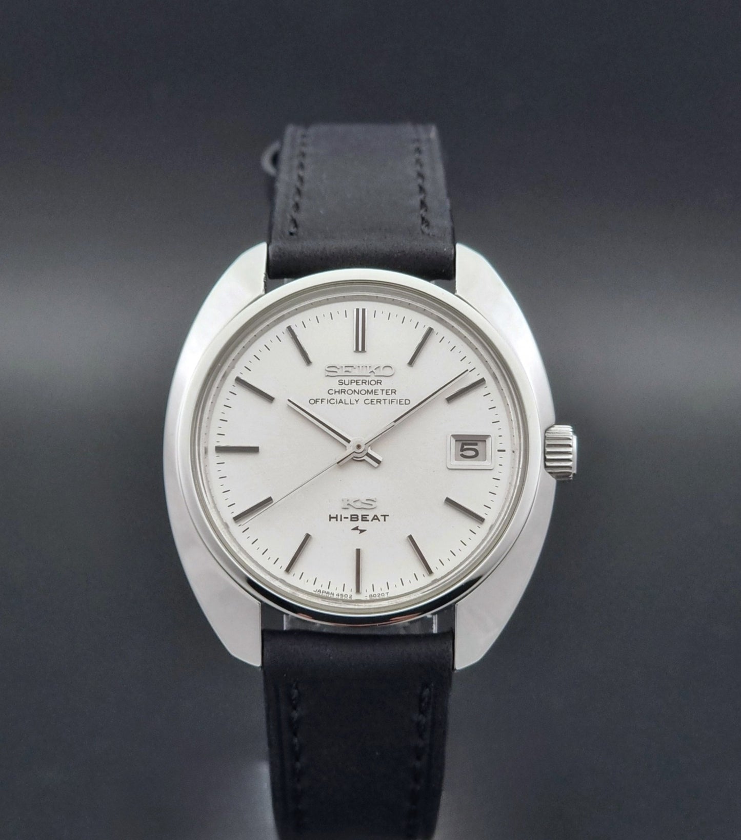 Vintage King Seiko Watch 4502-8010 with a black leather strap on a dark background close dial view