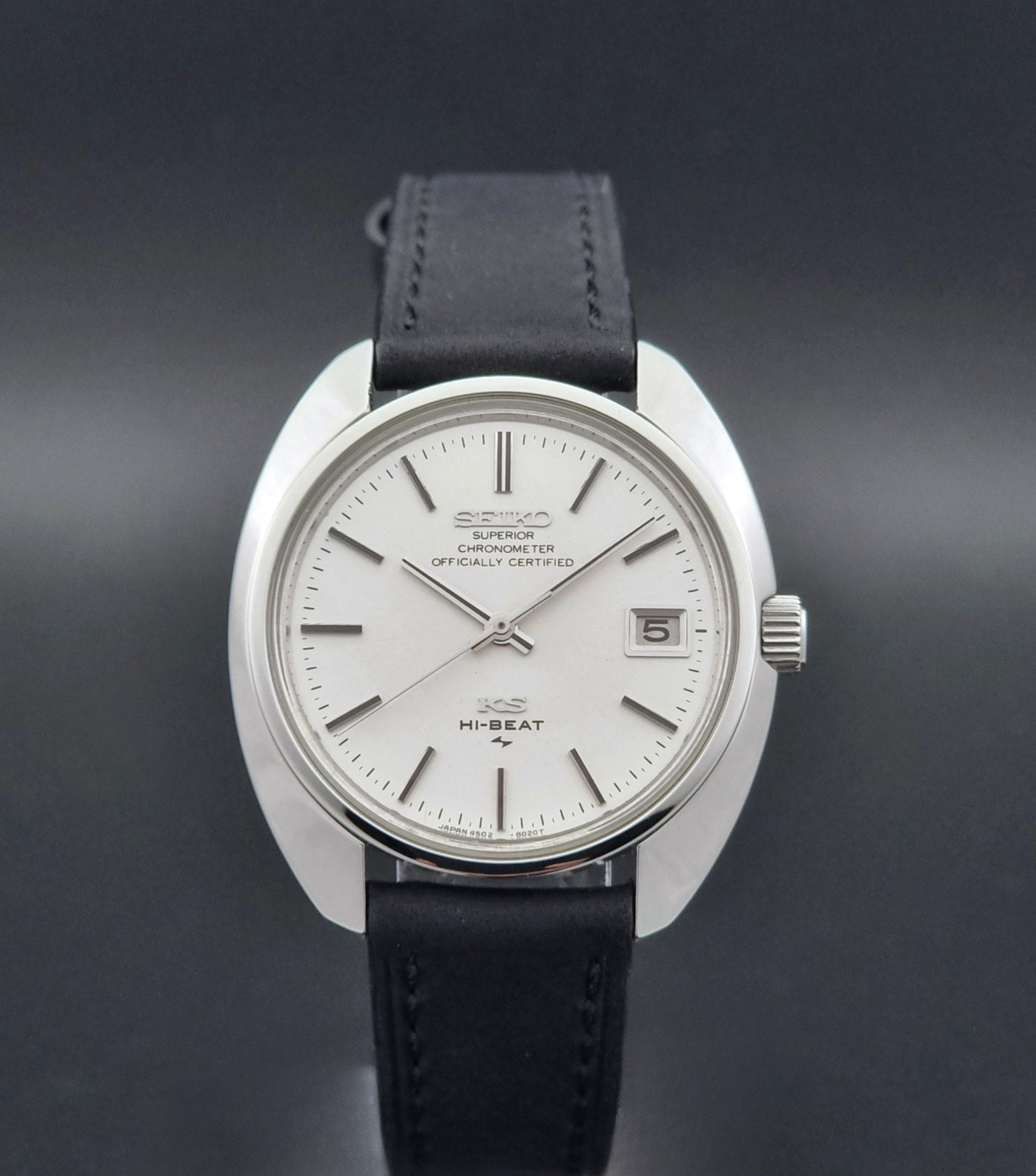 Vintage King Seiko Watch 4502-8010 with a black leather strap on a dark background close dial view