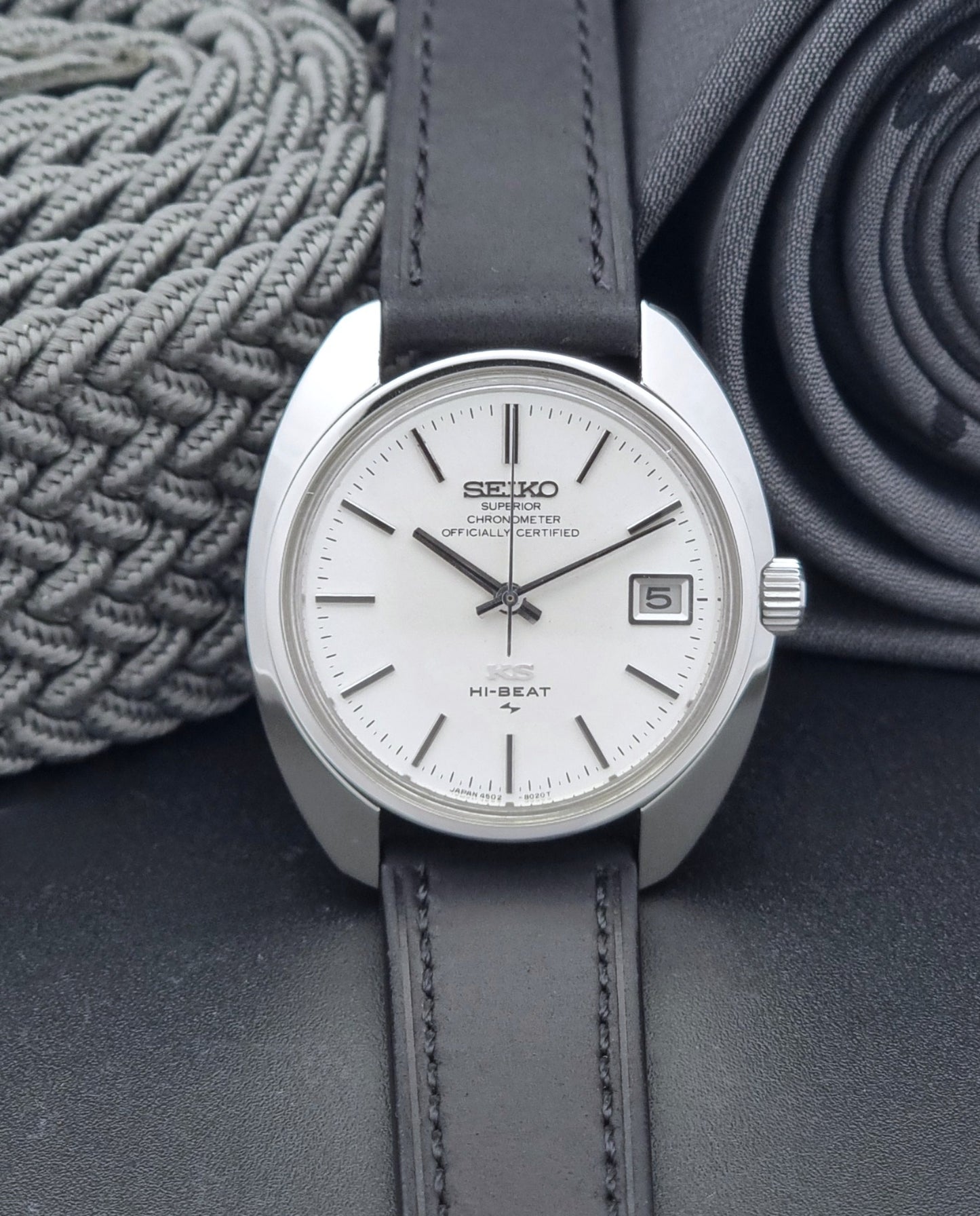 Vintage King Seiko Watch 4502-8010 with a black leather strap on a dark background dial view