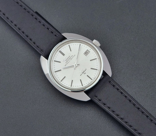Vintage King Seiko Watch 4502-8010 with a black leather strap on a dark background dial