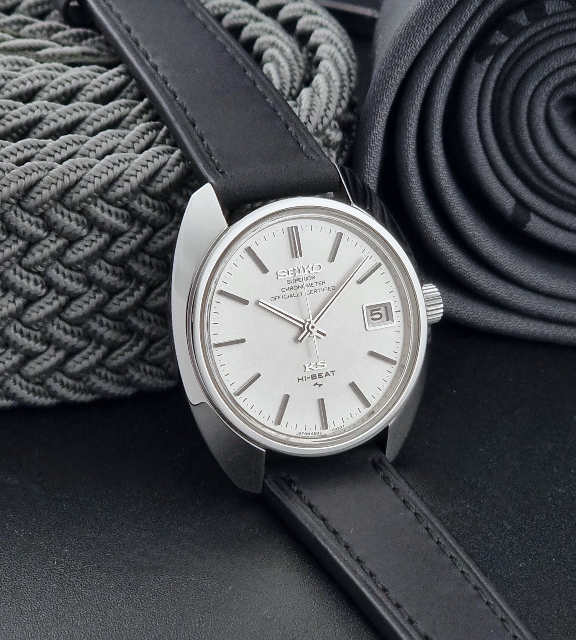 Vintage King Seiko Watch 4502-8010 with a black leather strap on a dark background side view