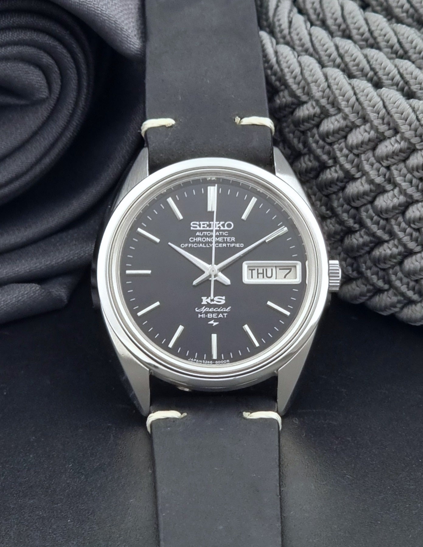Vintage King Seiko Watch Special 5246-6000 with black leather strap on a dark gray background dial view