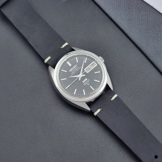 Vintage King Seiko Watch Special 5246-6000 with black leather strap on a dark gray background dial