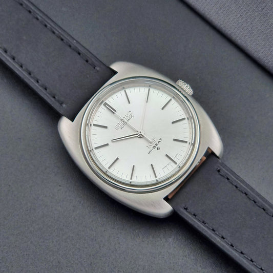 Vintage King Seiko 5621-700 Wristwatch with black leather strap on a dark surface