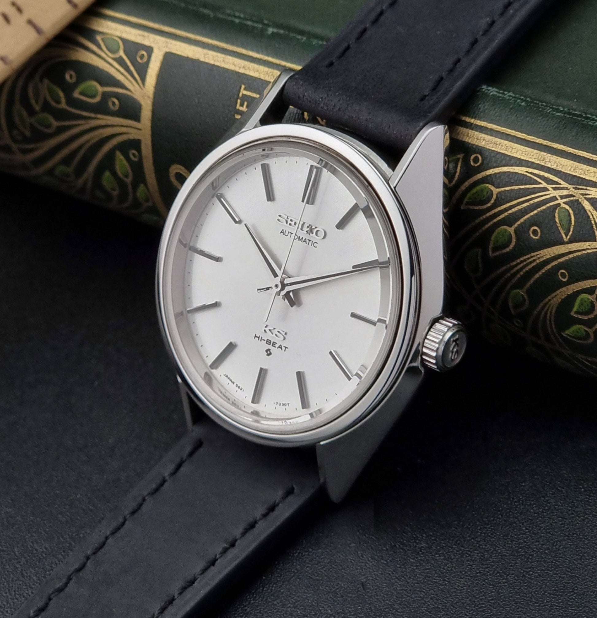 King Seiko watch with black strap on a dark surface