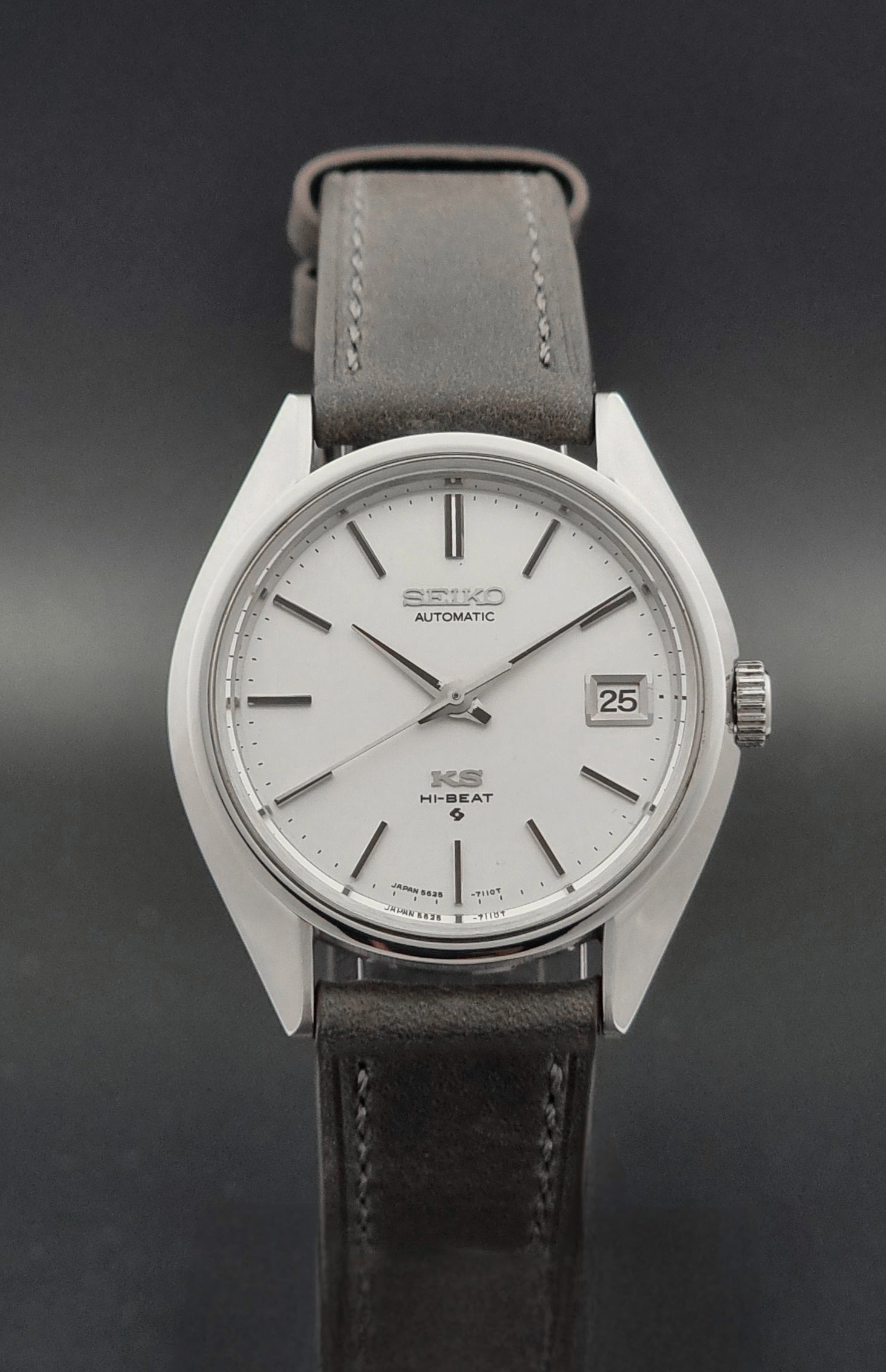 Vintage King Seiko 5625-7110 Wristwatch with a gray strap and white dial on a brown background close dial view