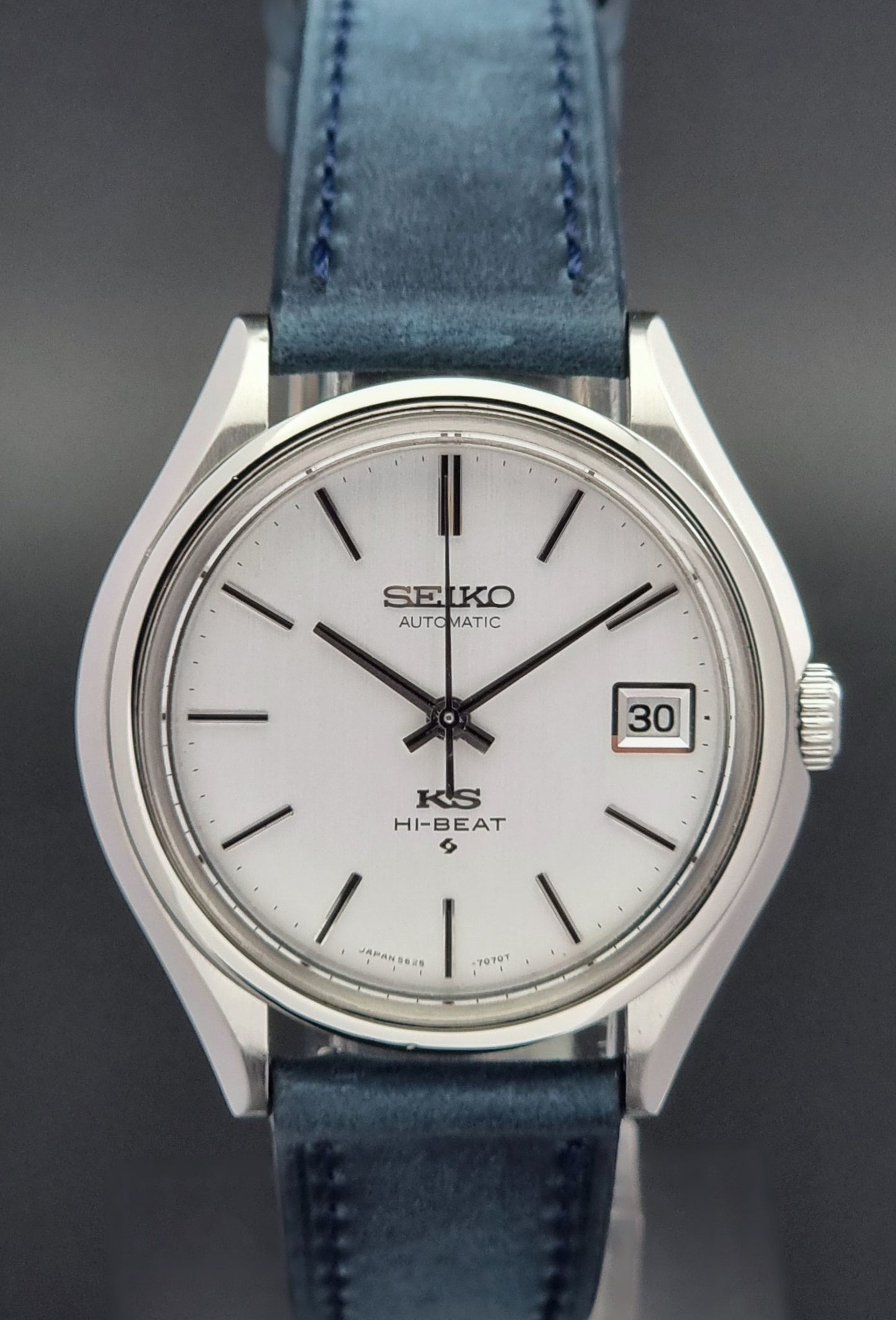 Vintage King Seiko watch with blue strap on a dark background
