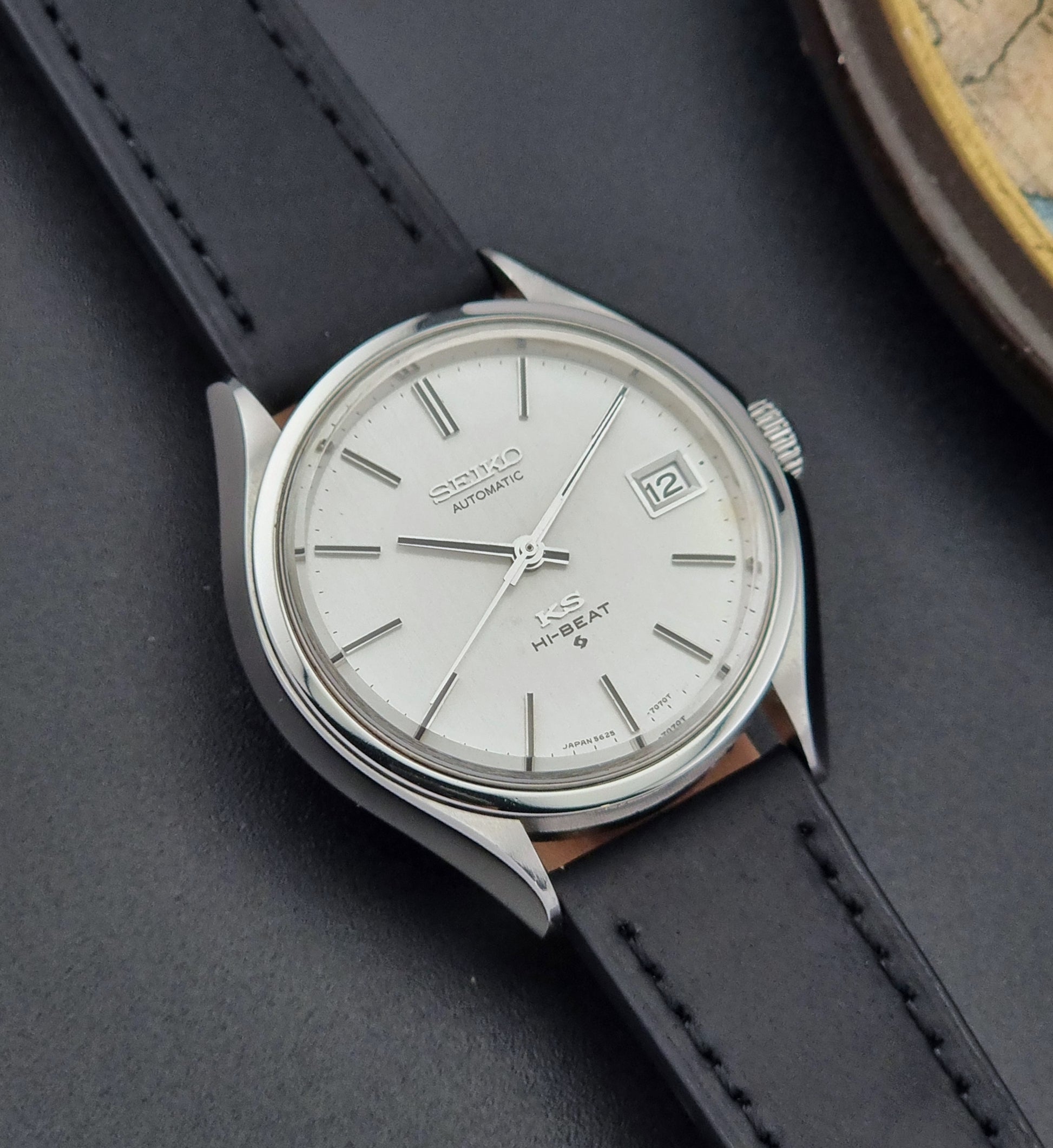 Vintage King Seiko Wristwatch 5625-7120 on a black strap on a dark background