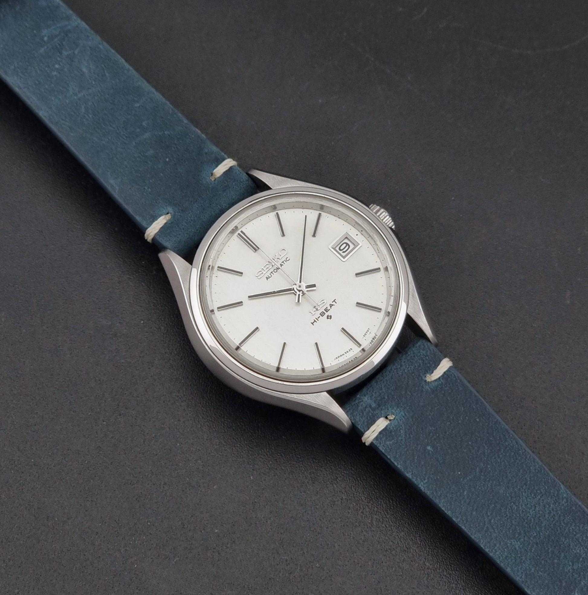 Vintage King Seiko 5625-7121 watch with blue strap on a dark gray background dial