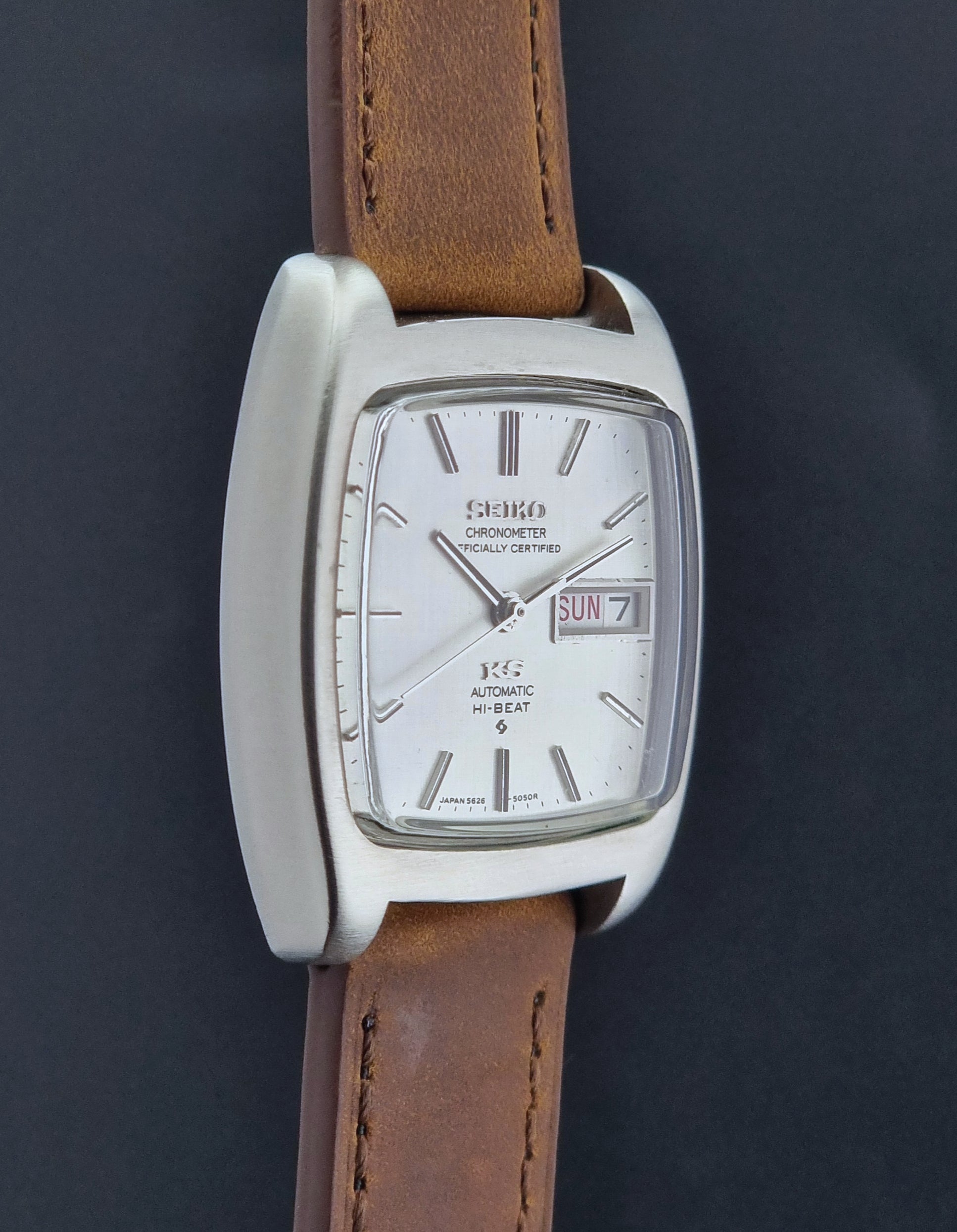 Vintage King Seiko 5626-5040 watch with brown leather strap on a textured gray background
