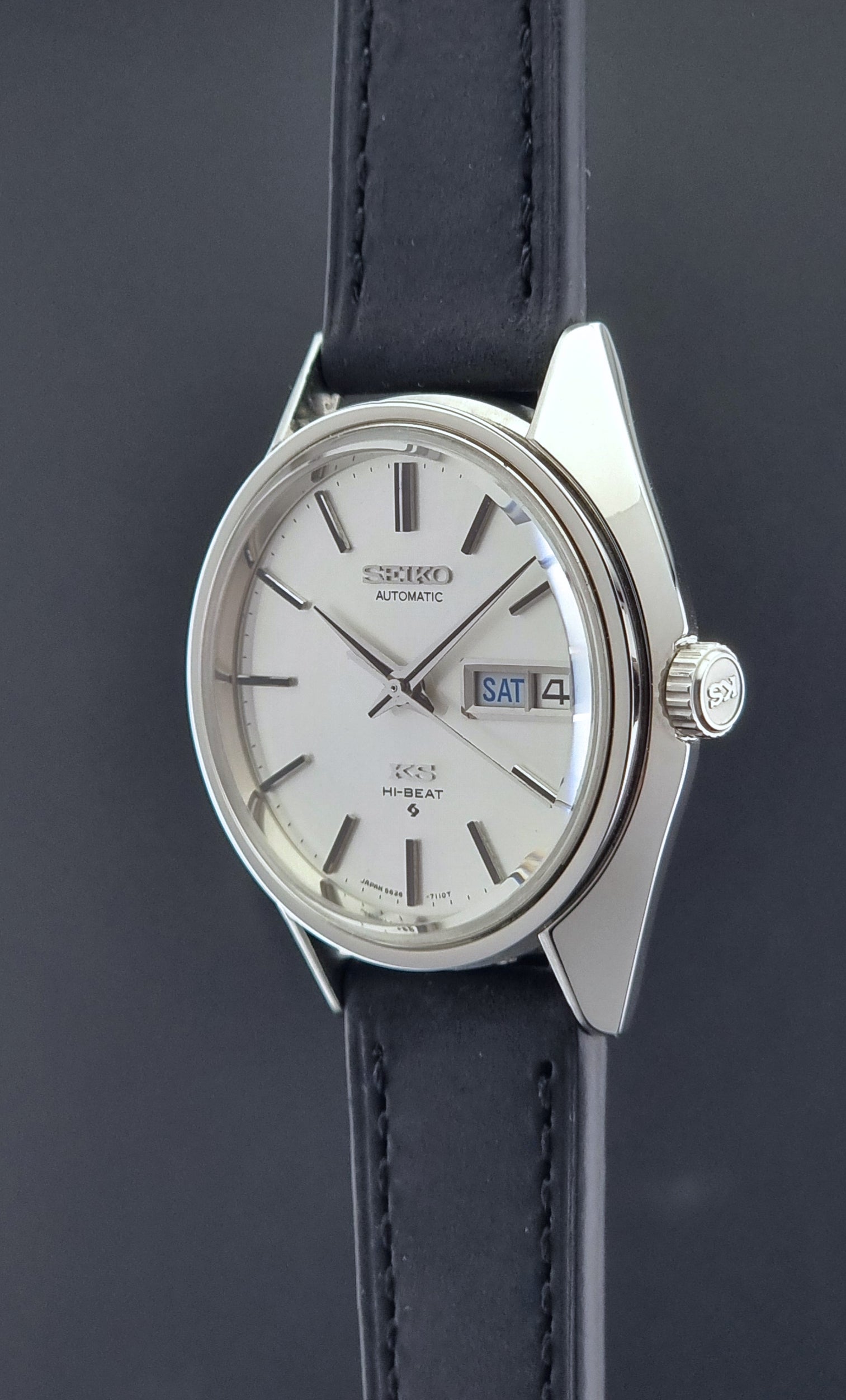 Vintage King Seiko Wristwatch 5626-7110 on a black strap on a dark background