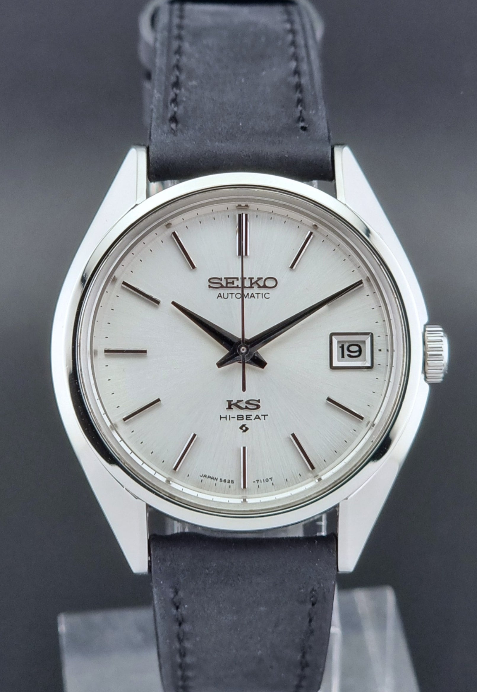 Vintage King Seiko watch with a white dial on a dark background