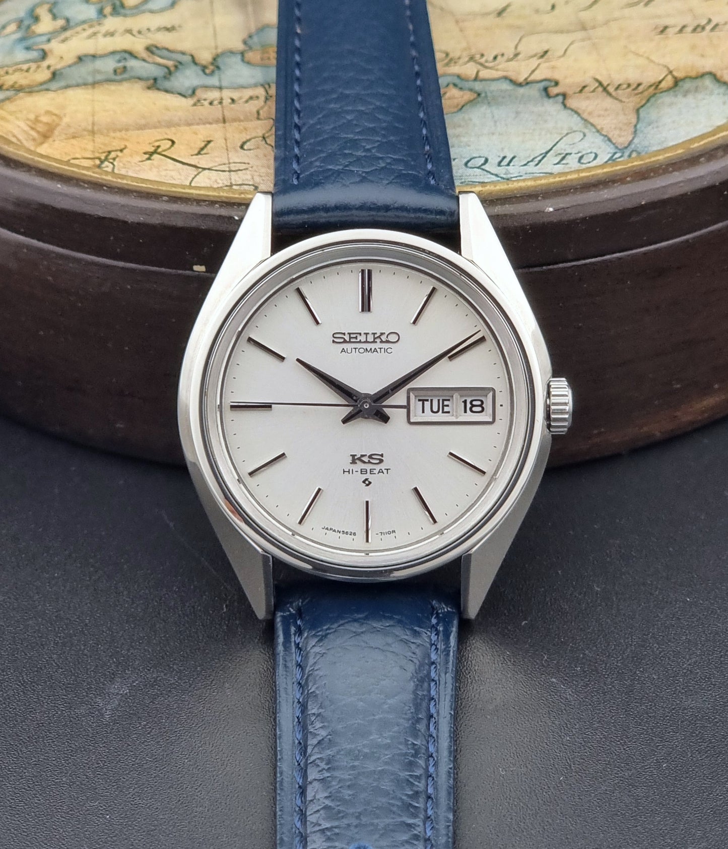King Seiko 5626-71113 Wristwatch with blue strap on a world map background