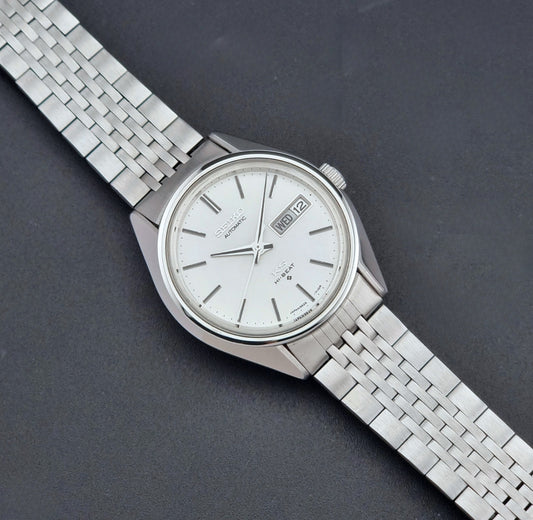 Vintage King Seiko Wristwatch 5626-7113 with a white face on a dark background dial