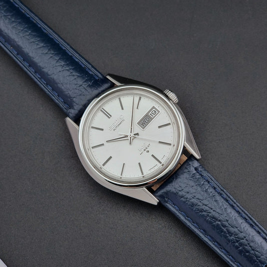 King Seiko 5626-71113 Wristwatch with blue strap and silver case on a dark gray background