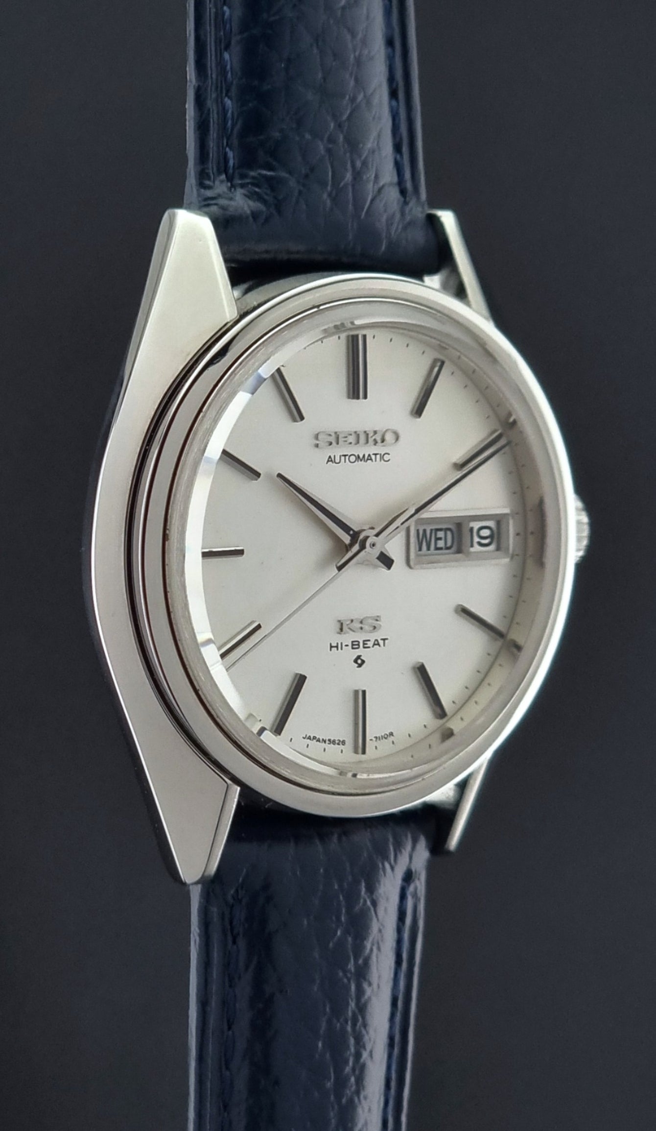 Vintage King Seiko 5626-71113 Wristwatch watch with a blue strap on a dark background