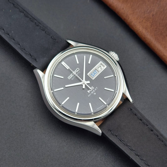 Vintage King Seiko Wristwatch 5626-7120 with black leather strap on a dark surface front