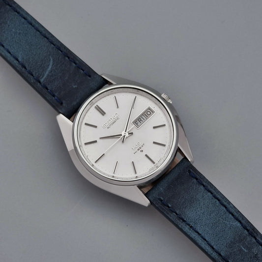 Vintage King Seiko Wristwatch 5626-8000 with a blue leather strap on a grey background