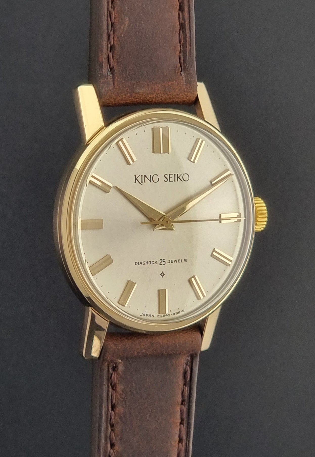 Vintage King Seiko Watch J14102 with brown leather strap on a wooden surface profile