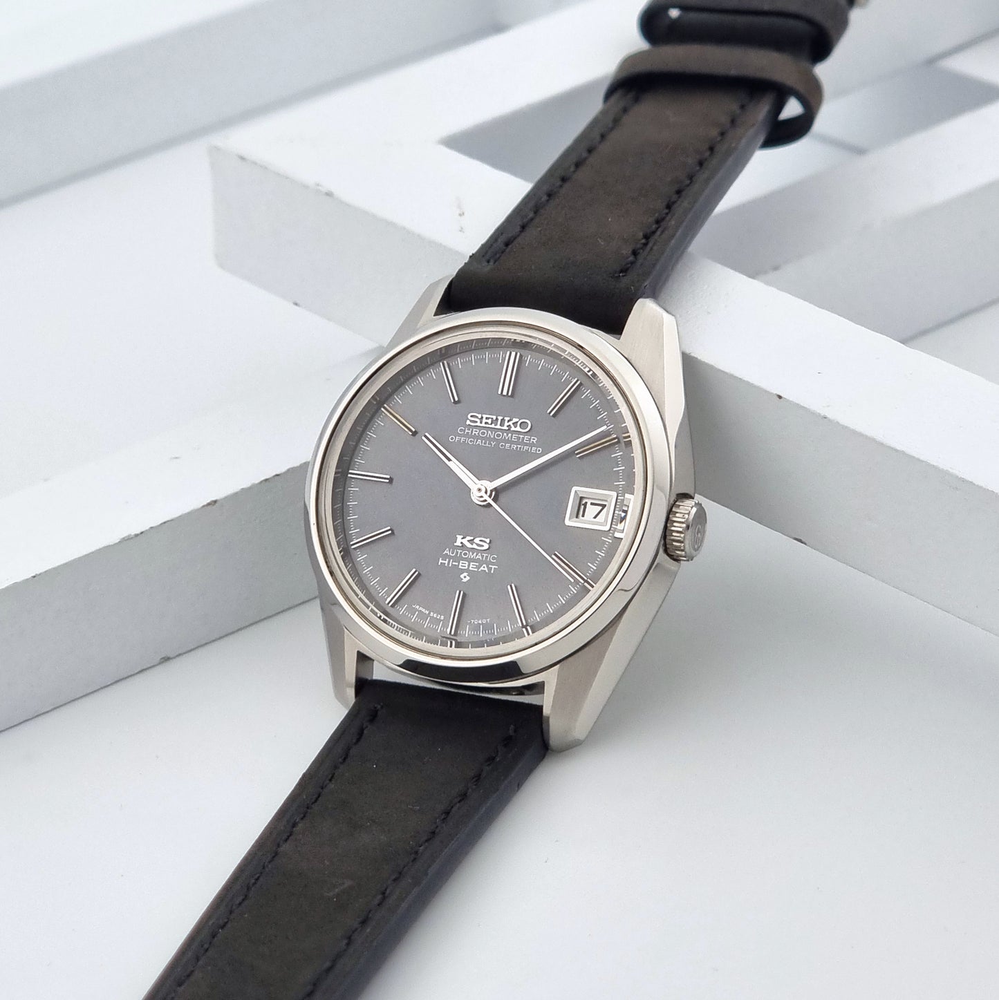 Vintage King Seiko 5625-7040 watch watch with black leather strap on a light gray background crown view
