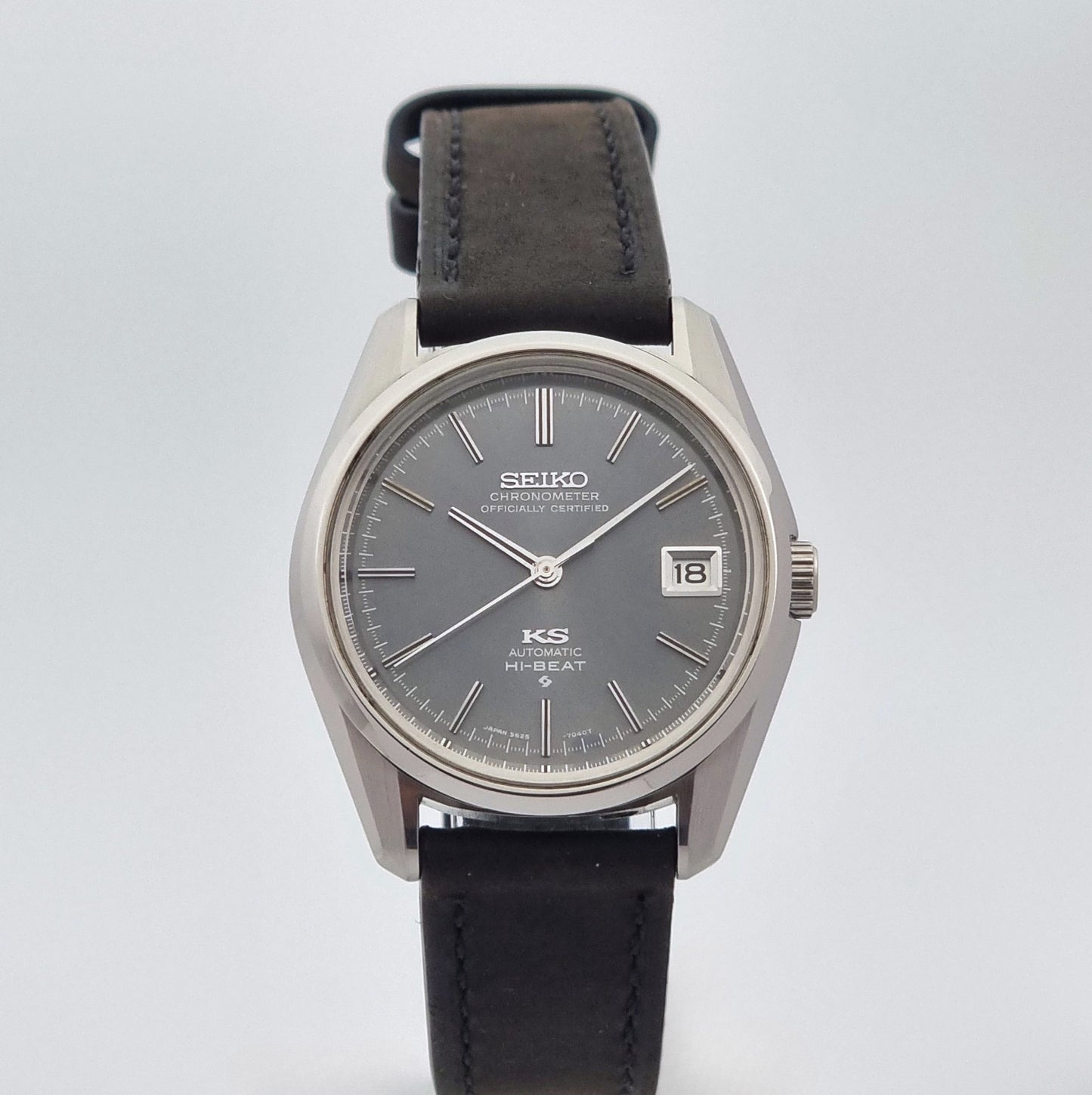 Vintage King Seiko 5625-7040 watch watch with black leather strap on a light gray background close dial view
