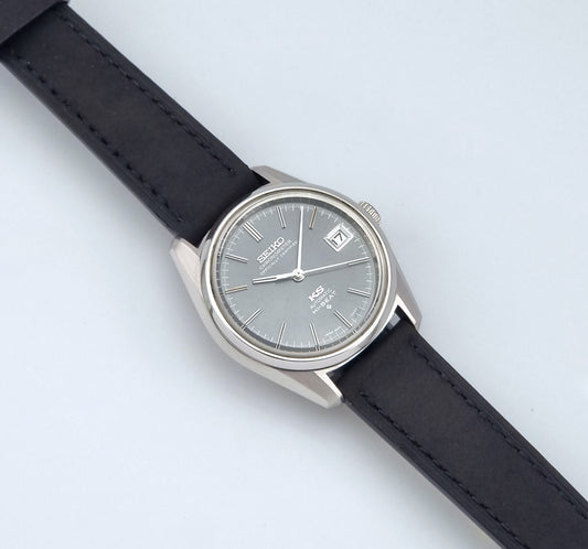 Vintage King Seiko 5625-7040 watch watch with black leather strap on a light gray background dial