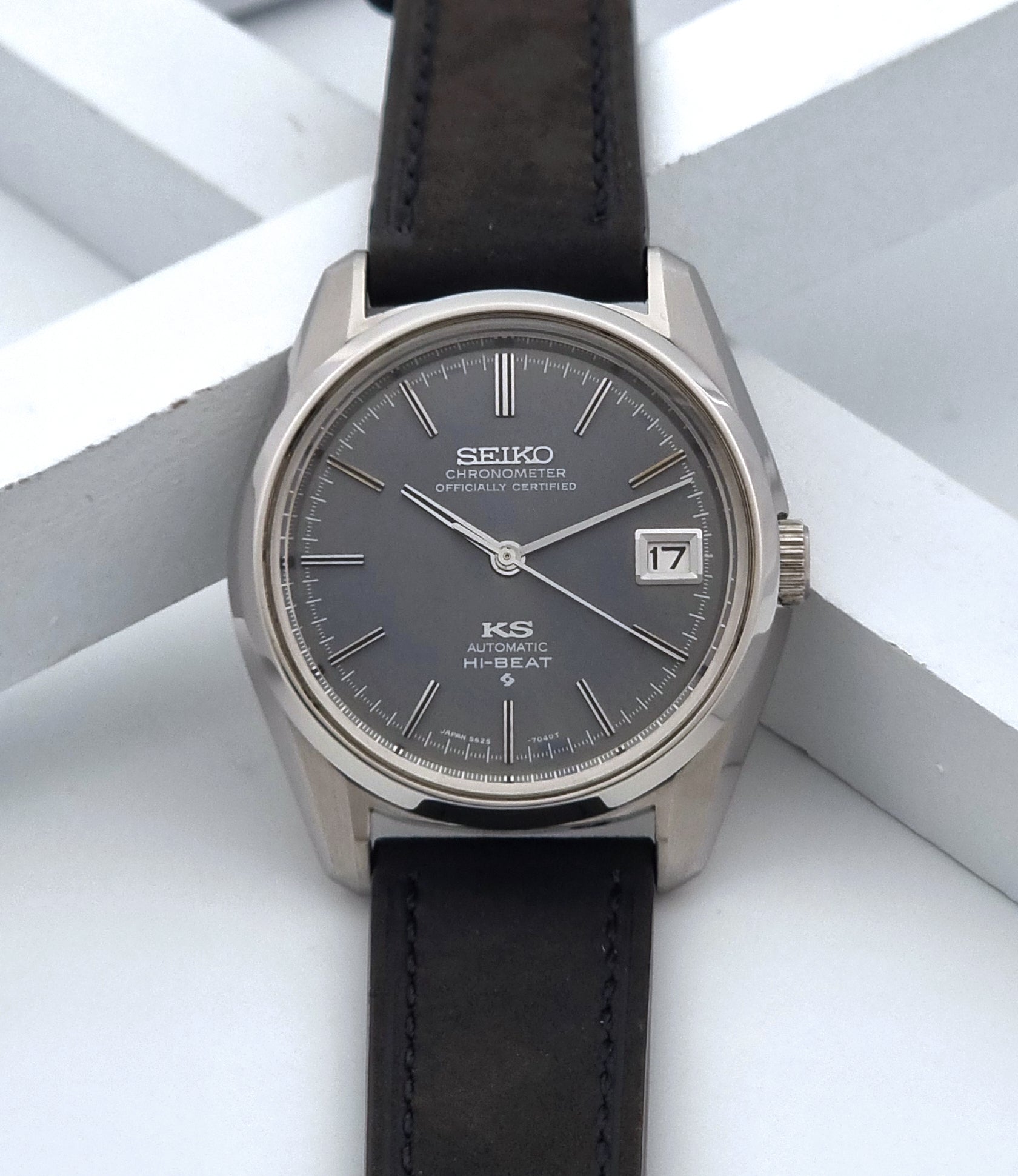 Vintage King Seiko 5625-7040 watch watch with black leather strap on a light gray background dial view