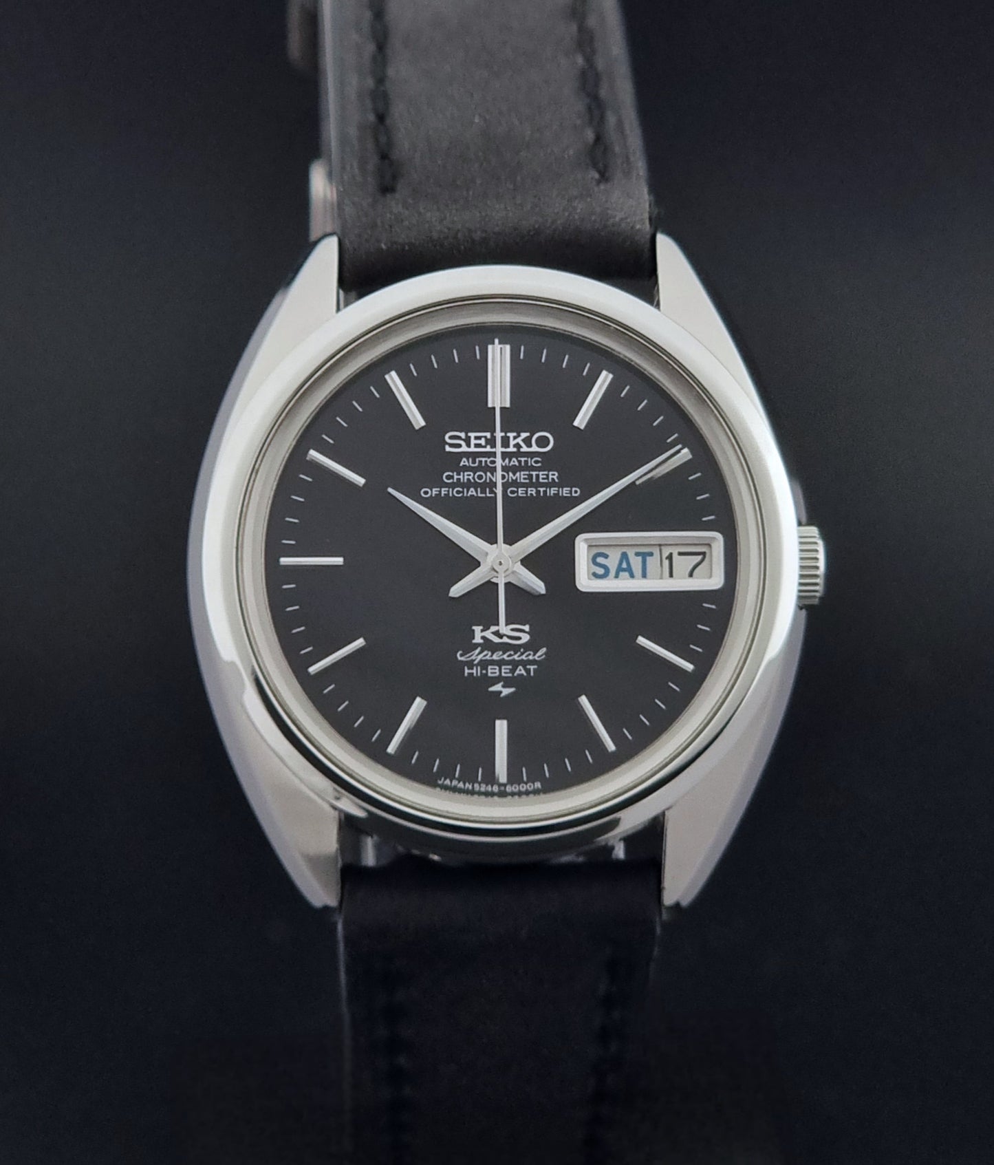 Vintage King Seiko Watch Special 5246-6000 with black leather strap on a light gray background close dial view