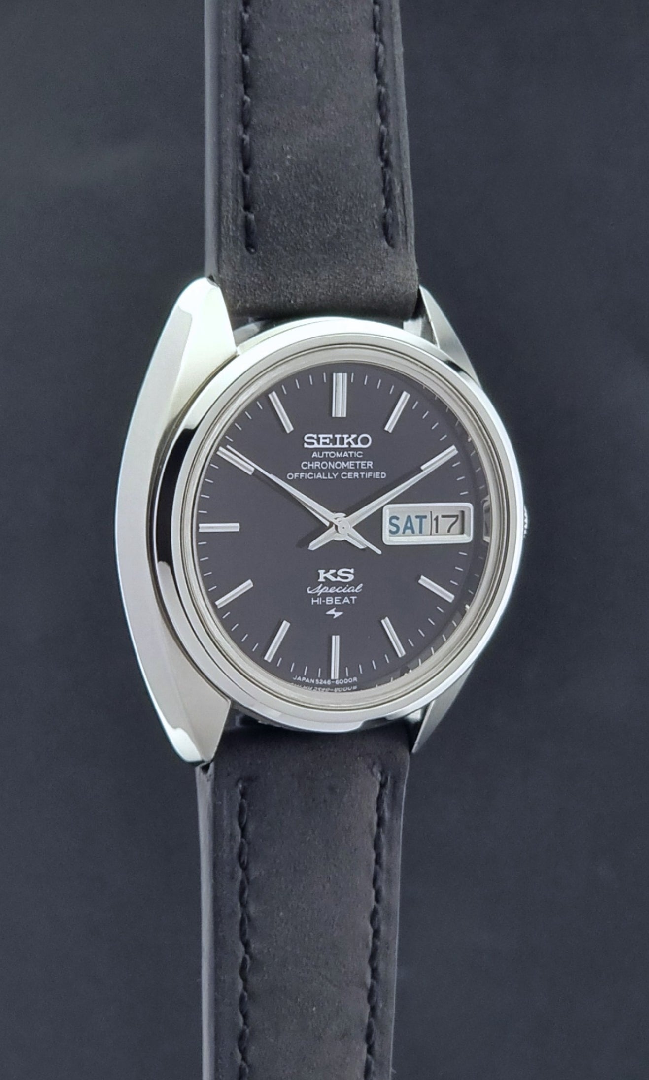 Vintage King Seiko Watch Special 5246-6000 with black leather strap on a light gray background side profile vierw