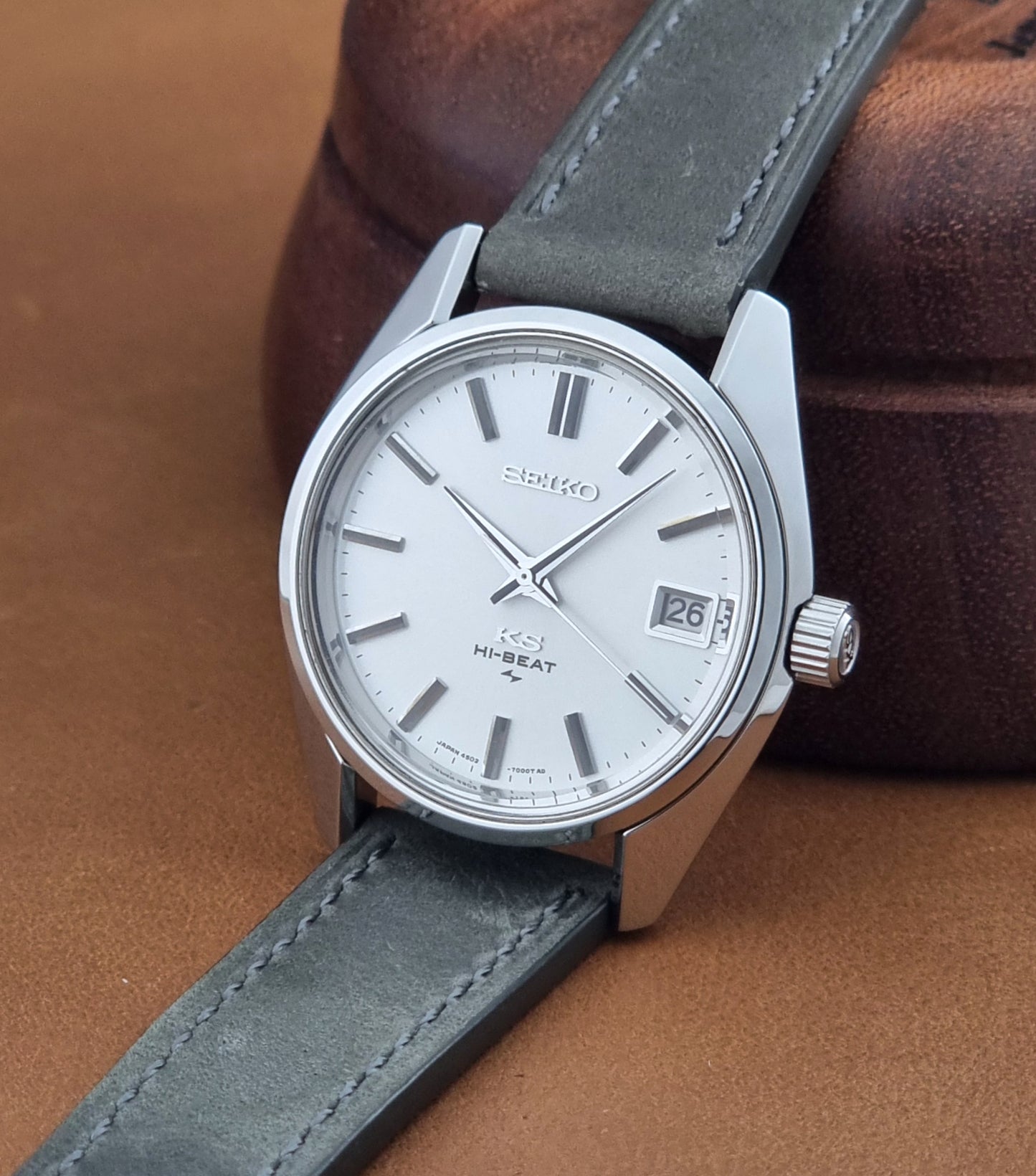 Vintage King Seiko 4502-7001 watch with a white dial on brown background crown view