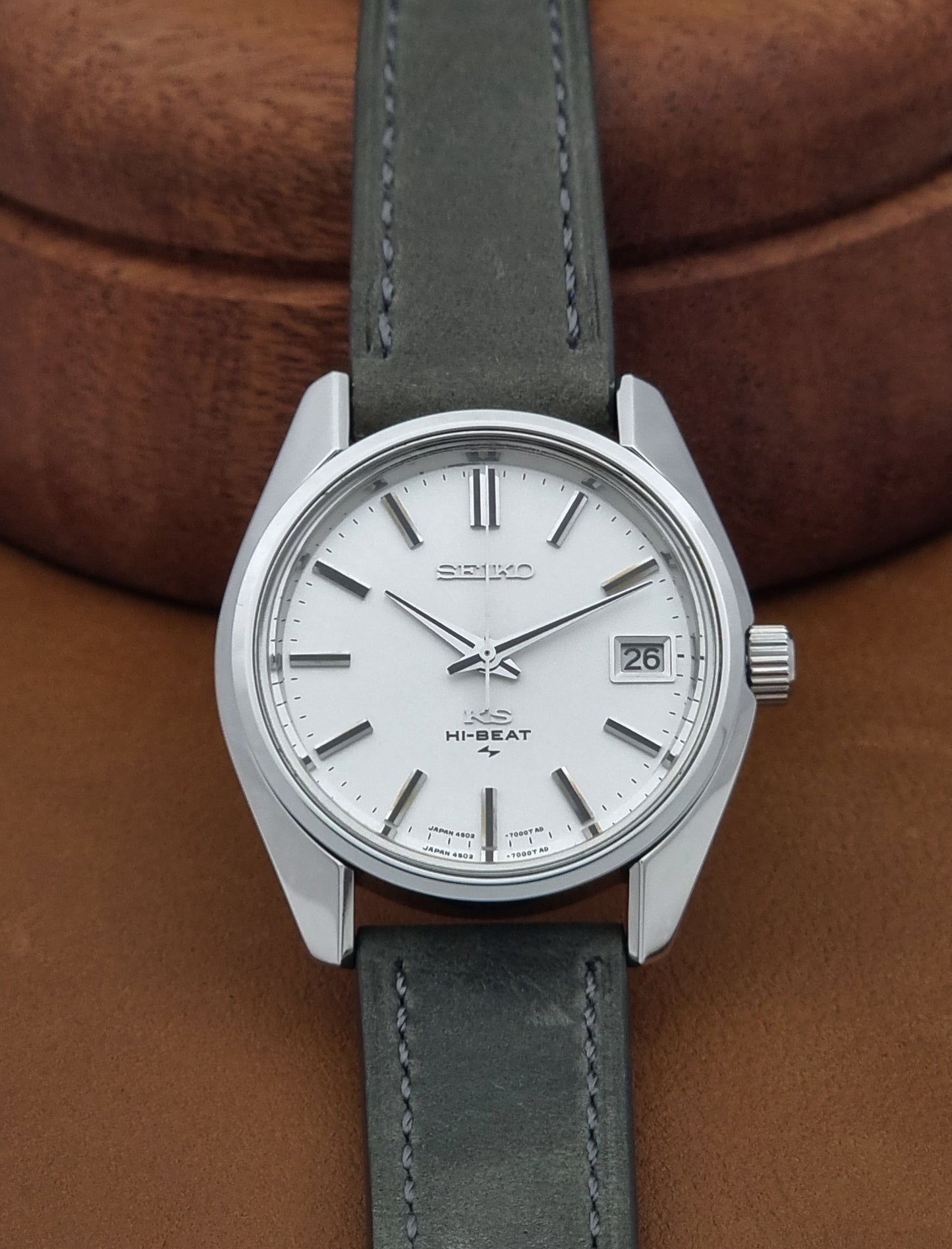Vintage King Seiko 4502-7001 watch with a white dial on brown background dial view