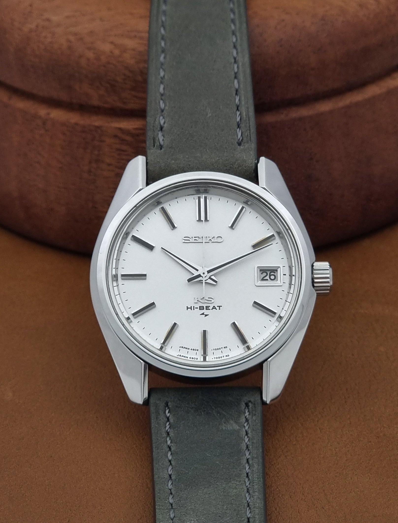 Vintage King Seiko 4502-7001 watch with a white dial on brown background dial view
