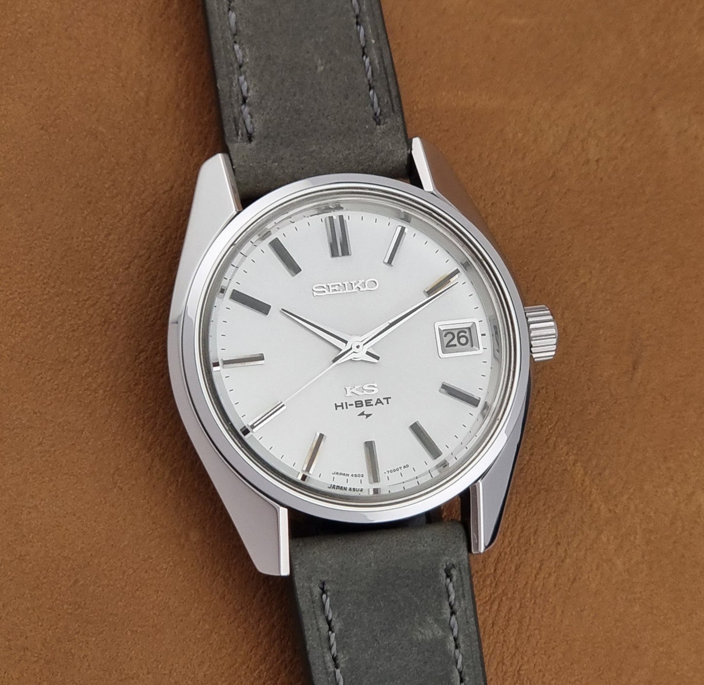 Vintage King Seiko 4502-7001 watch with a white dial on brown background front view