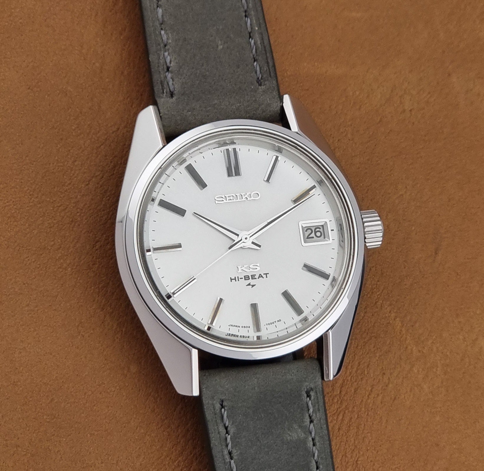 Vintage King Seiko 4502-7001 watch with a white dial on brown background front view