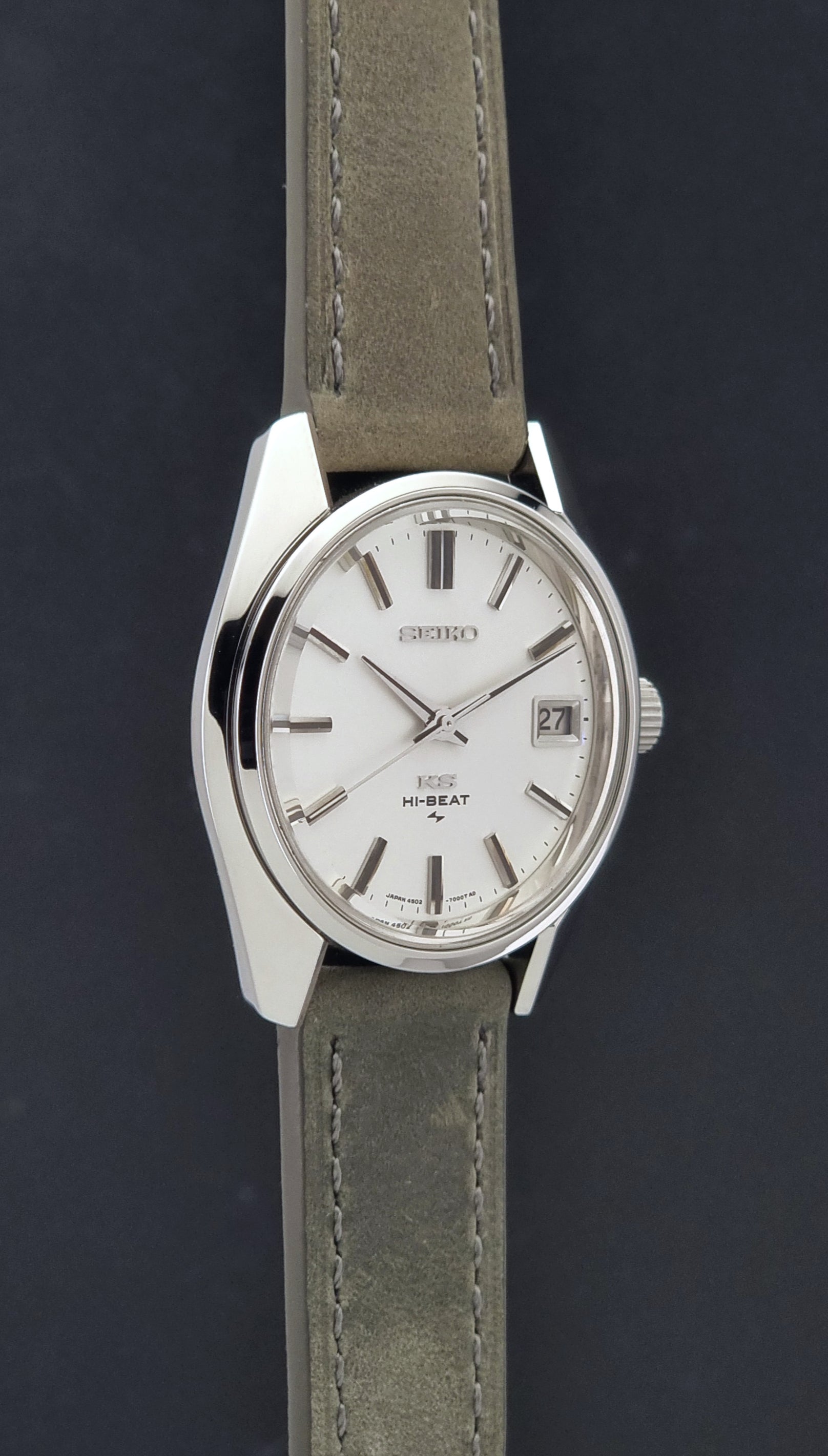 Vintage King Seiko 4502-7001 watch with a white dial on brown background side profile view