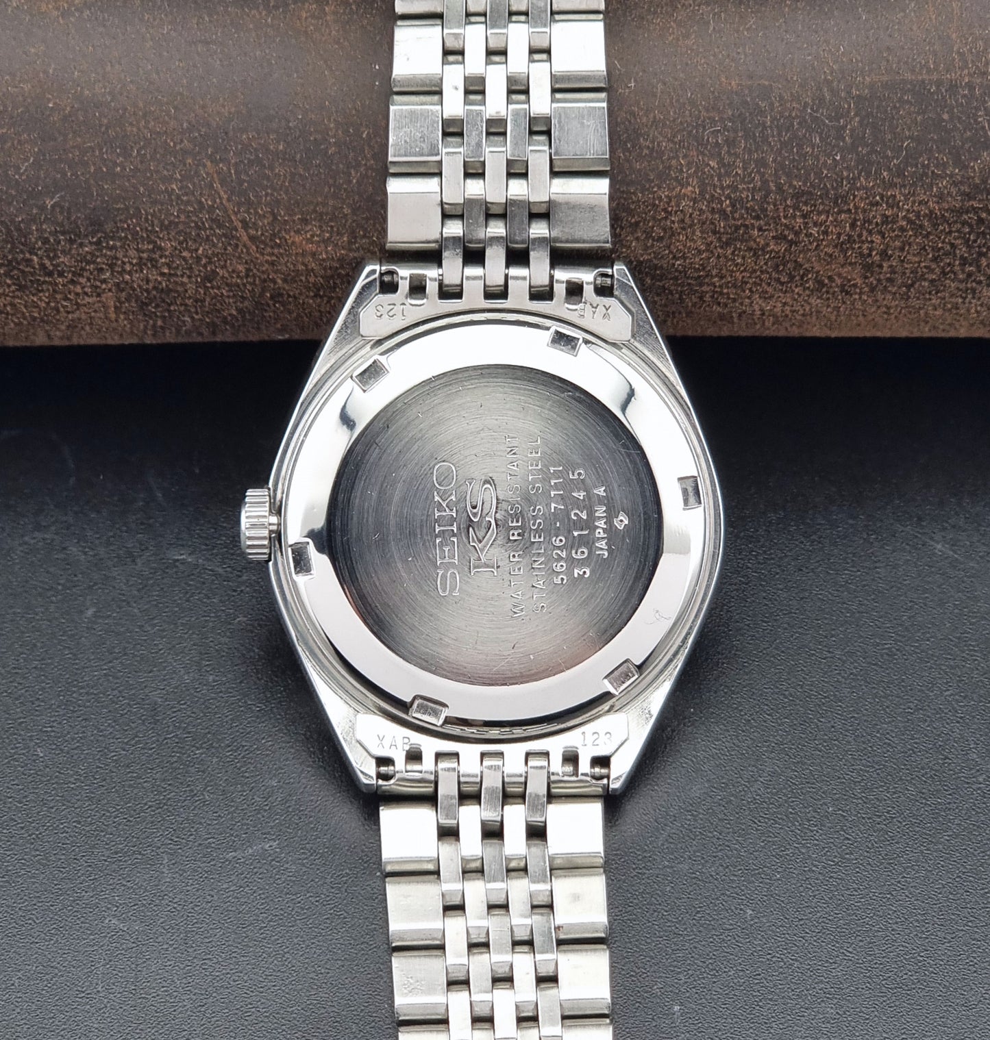Vintage King Seiko 5626-7111 Wristwatch with white dial on a dark background caseback view