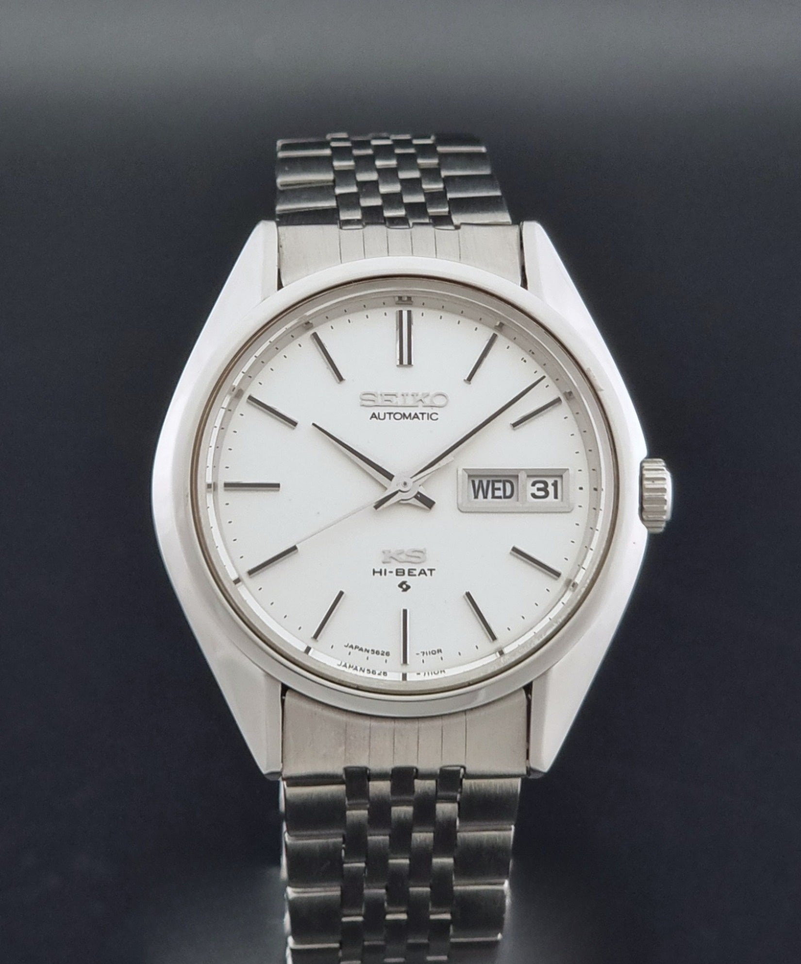 Vintage King Seiko 5626-7111 Wristwatch with white dial on a dark background dial view