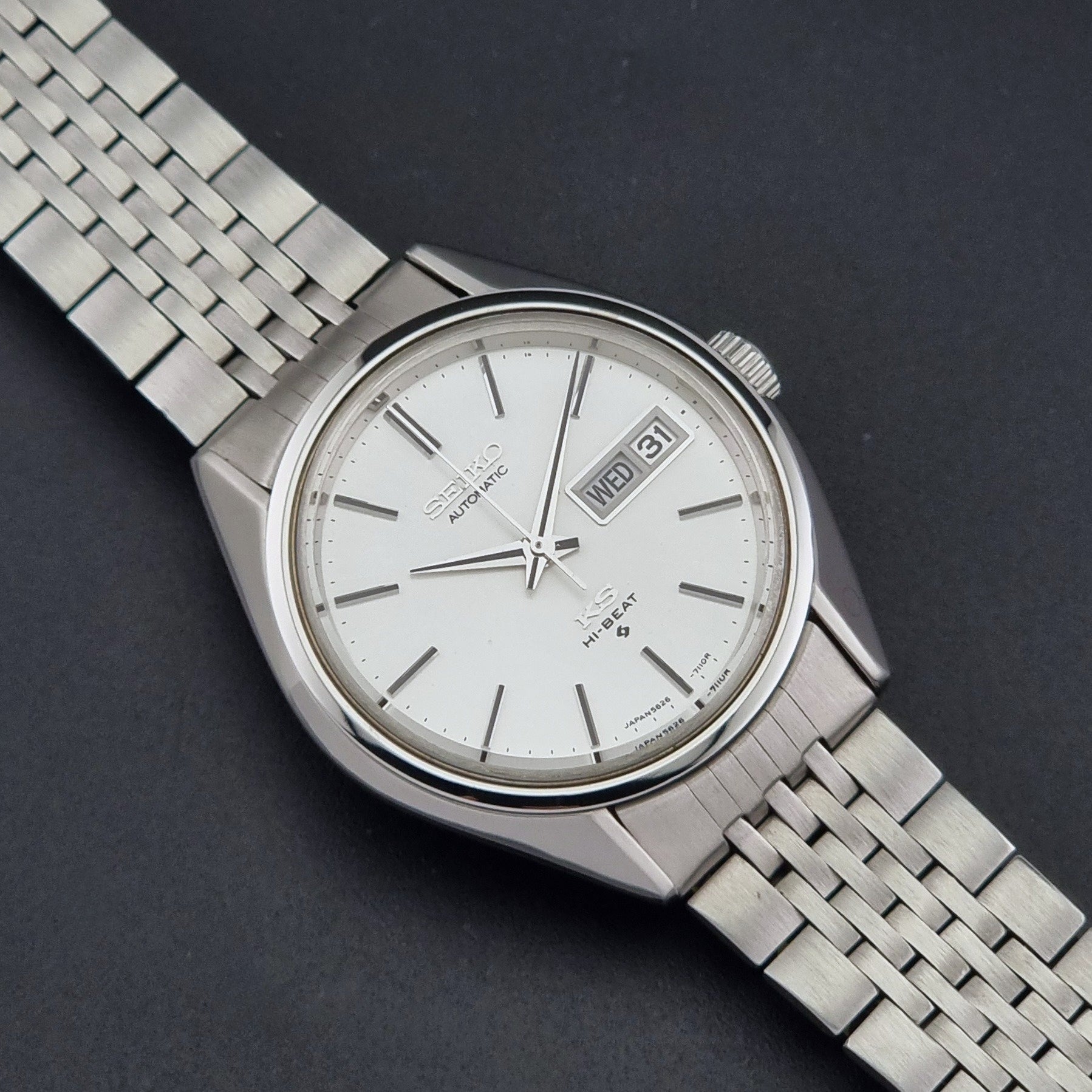 Vintage King Seiko 5626-7111 Wristwatch with white dial on a dark background close dial view