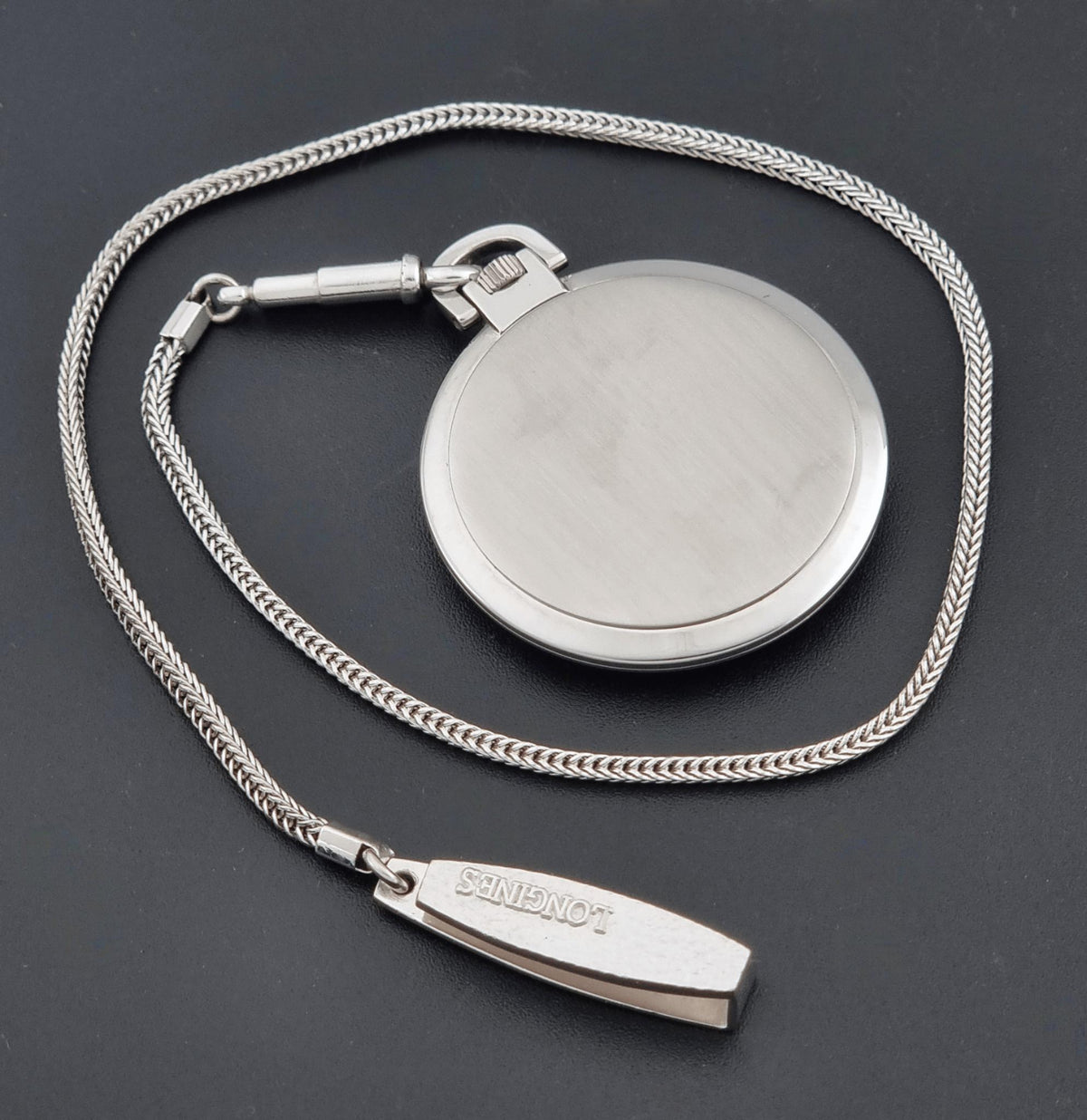Circa 1976 vintage Longines 1097-4 pocket watch; caseback view showing the rear case and visible markings